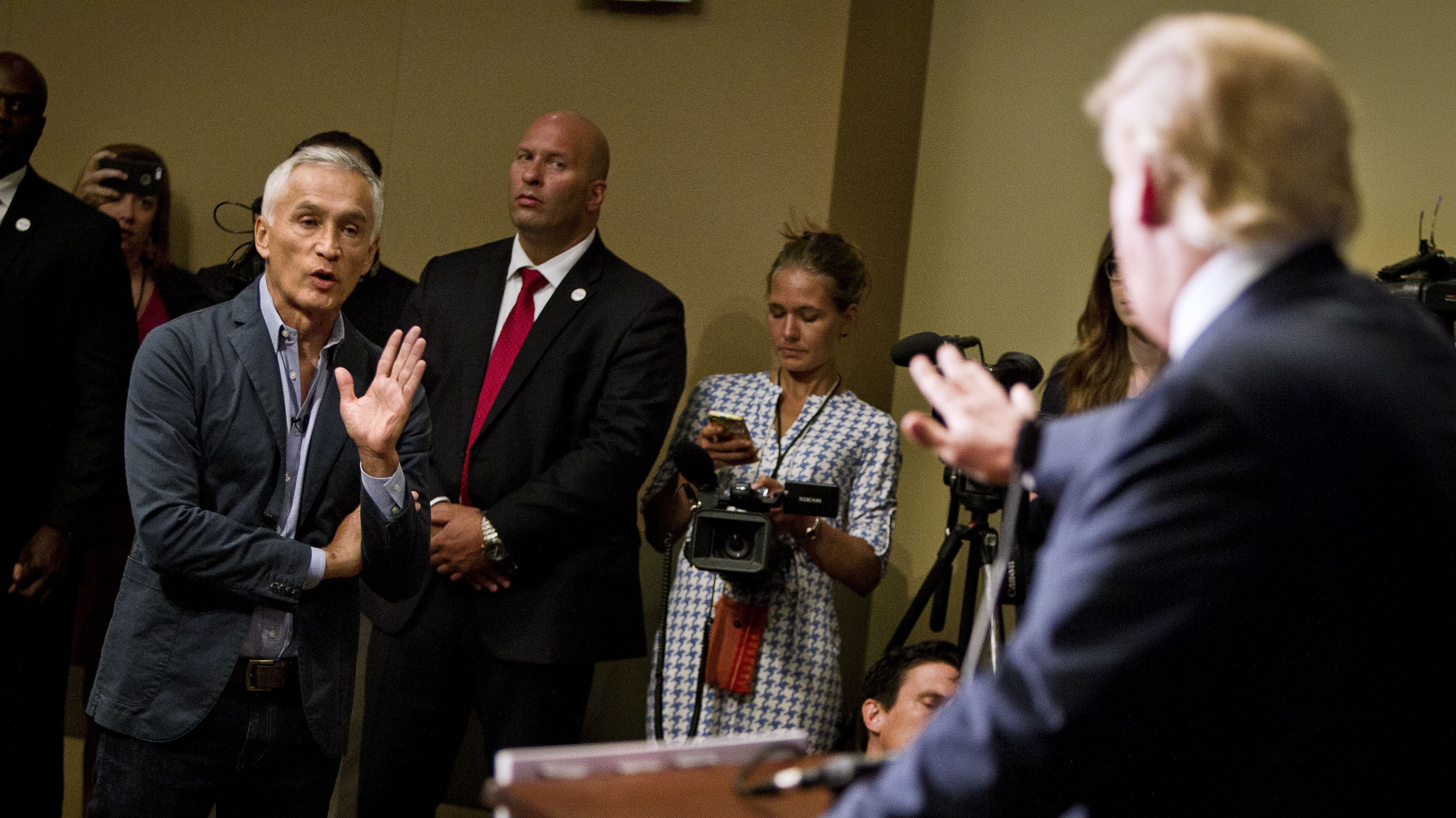 Republican presidential candidate Donald Trump spars with Univision reporter Jorge Ramos before his "Make America Great Again Rally" at the Grand River Center in Dubuque, Iowa, August 25, 2015.