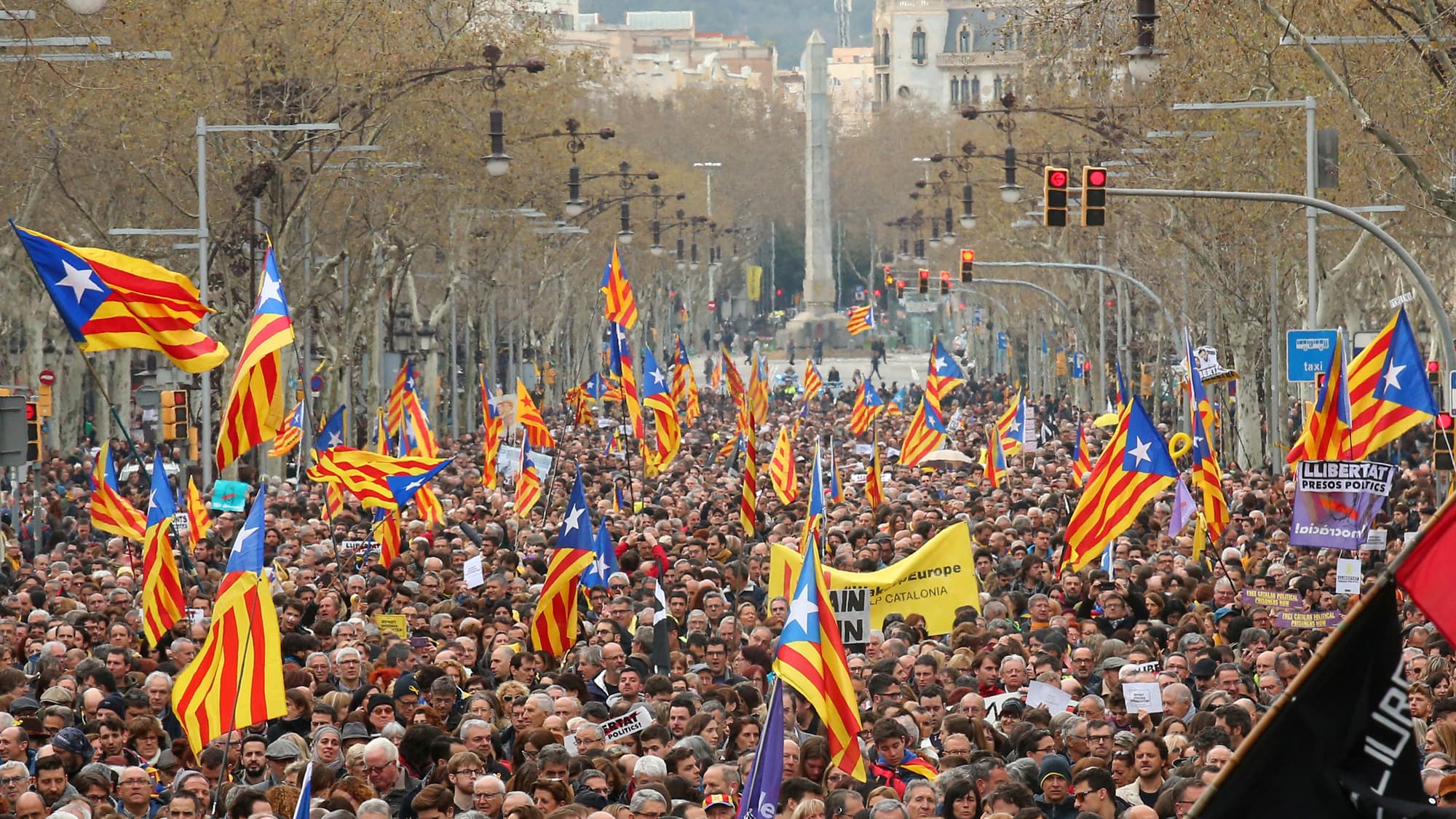 People protest after former president Carles Puigdemont was detained in Germany, during a demonstration held by pro-independence associations in Barcelona, Spain March 25, 2018.