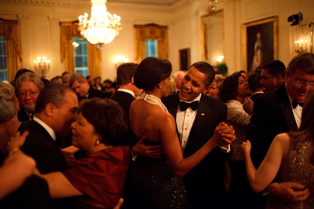 Former President and First Lady Michelle Obama dance together at the Governors Ball in 2009.