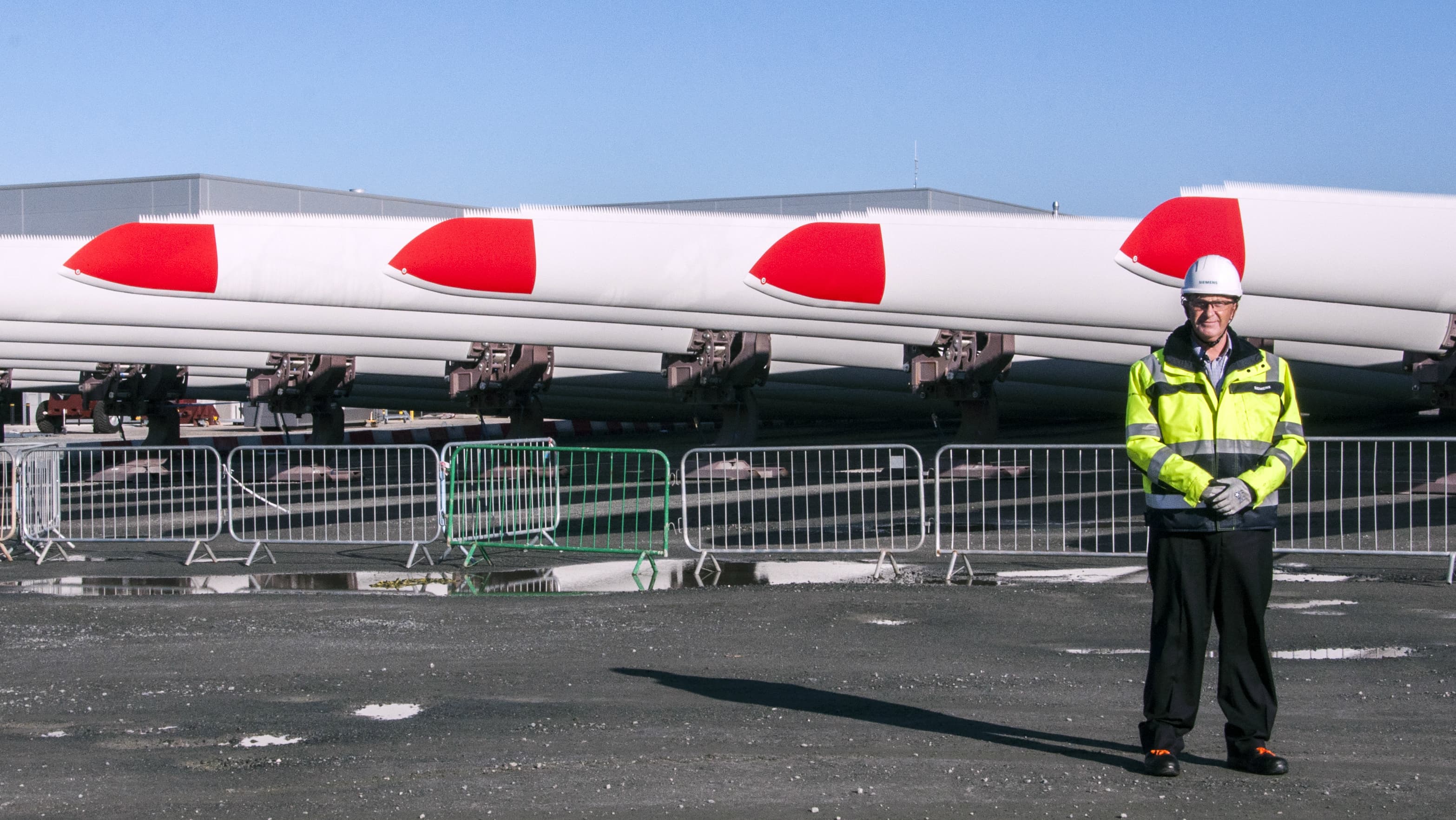 Port Operations head Barry Denness stands in front of massive, newly-minted wind turbine blades at Siemens's new plant in Hull, UK. “(They're) in service for 25 years in the North Sea, not the most hospitable of conditions," he says. "Hence the reason why