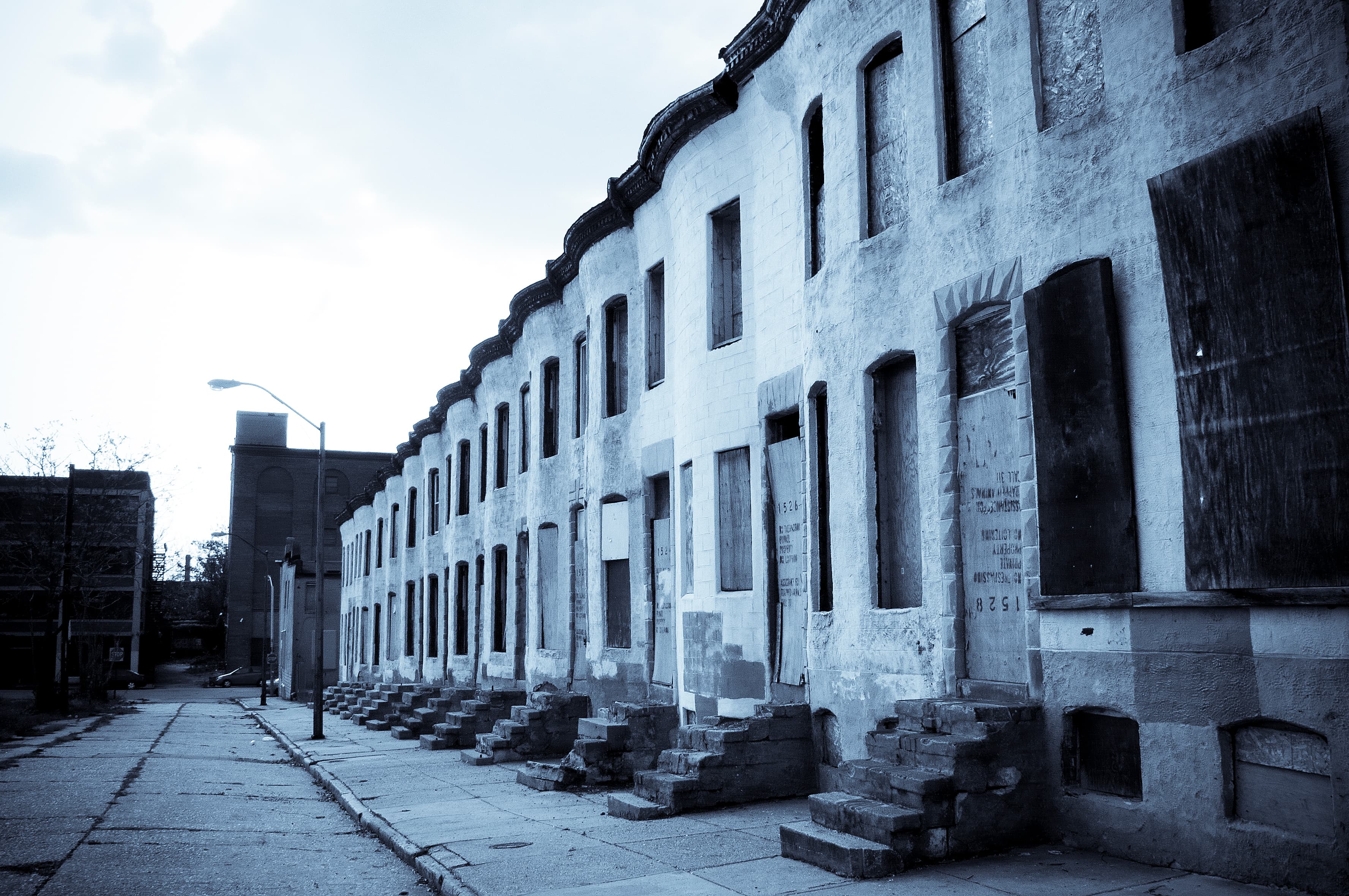 A row of abandoned houses in Baltimore, Maryland. Much of the city's housing stock is old and in disrepair, hurting the city's ability to retain its citizens.
