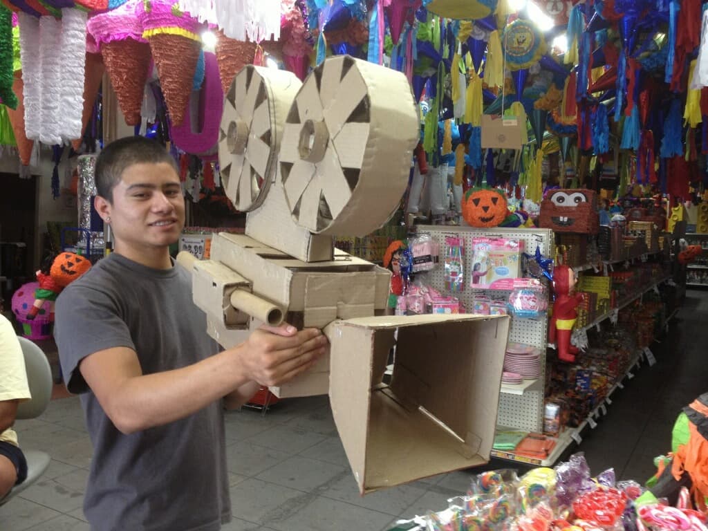 Juan Luis Garcia, a photographer and graphic designer, shows off the camera piñata he used to shoot promotional posters for the 20th San Diego Latino Film Festival in 2013.