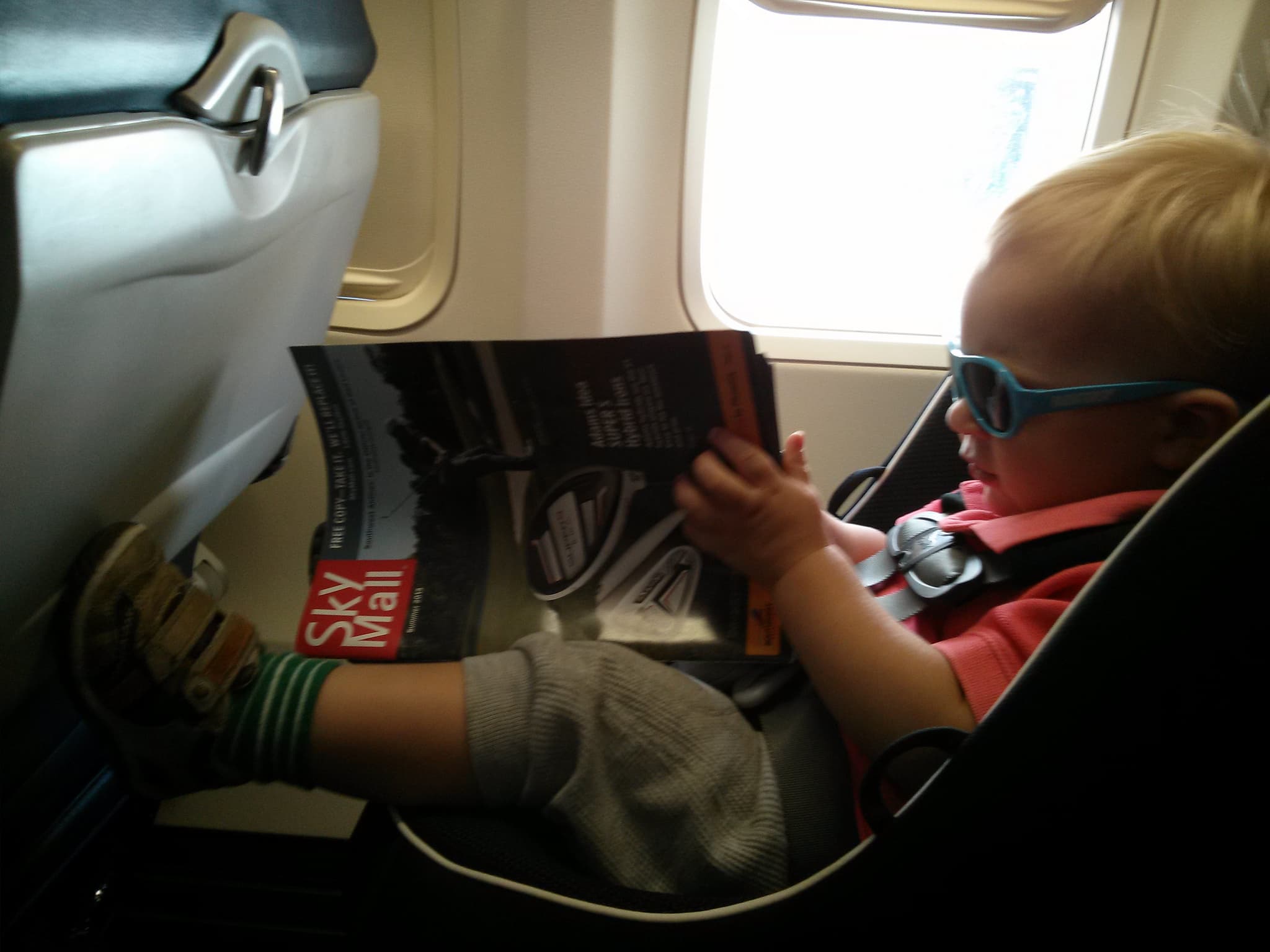 Scoping out the latest products from SkyMall magazine.