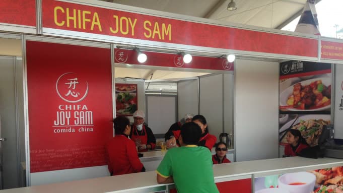 A booth serving Chifa booth at a food conference.