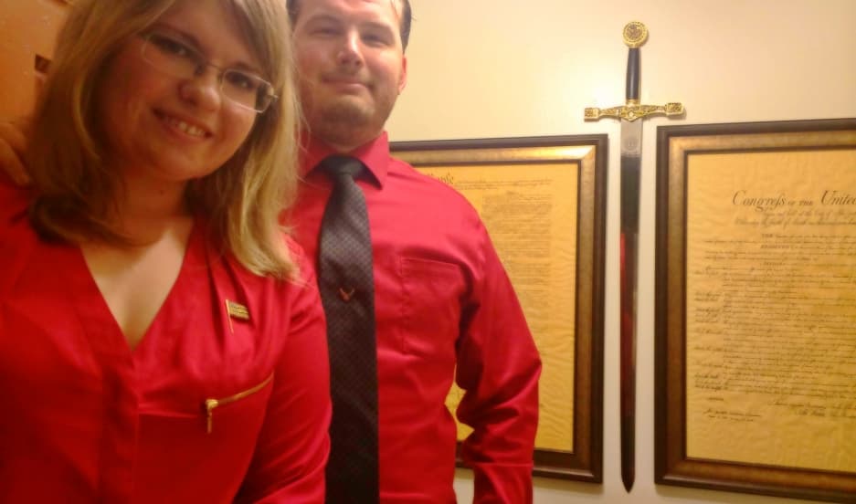 Arianna Mendez and Chris Alvarez in the entryway of Alvarez's home. The couple don't always agree on the US' policy toward Cuba.