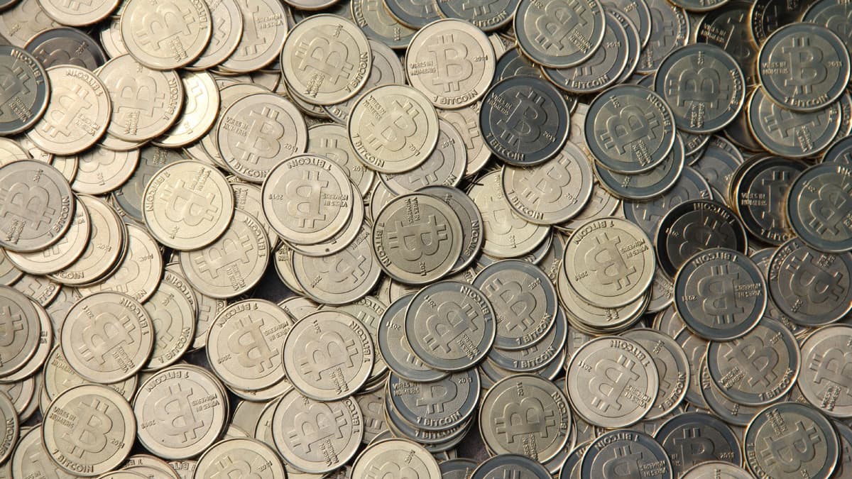 Bitcoins, represented here with with actual coins, are a type of digital currency that have spearhead a new nefarious activity known as "cryptojacking."