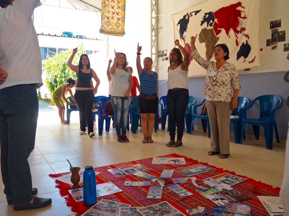 Bolivian, Colombian, Venezuelan and Peruvian immigrants participate in a team-building activity before their community organizing training at CAMI.