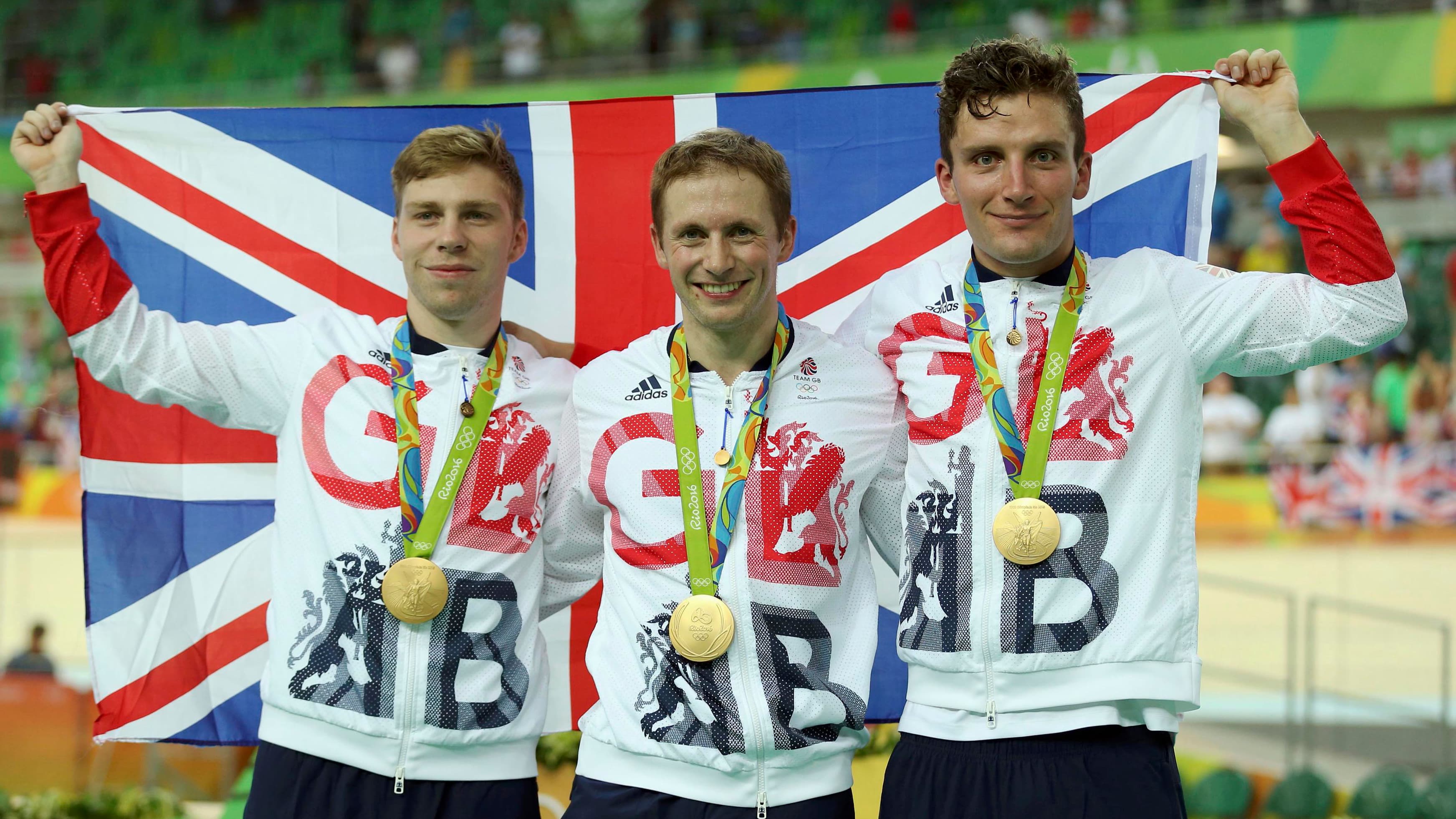 Great Britain captures gold in cycling for the men's team sprint at the Rio Olympics - Philip Hindes, Jason Kenny and Callum Skinner of Great Britain pose with their gold medals. Aug. 11, 2016.