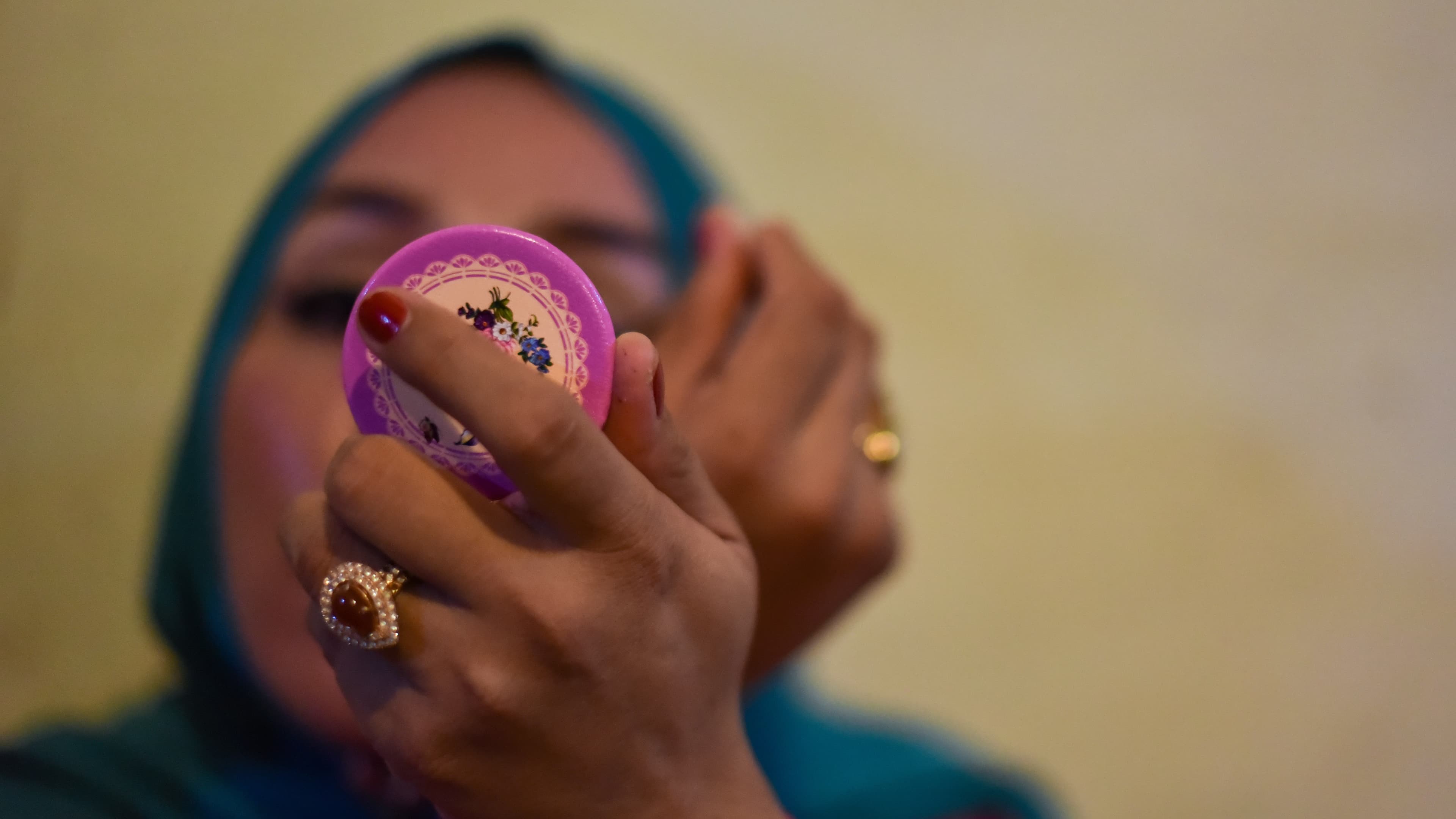 Echa wears the hijab because it's the law for women in Aceh. Echa is transgender, and when she wears the headscarf, she says no one calls her names.