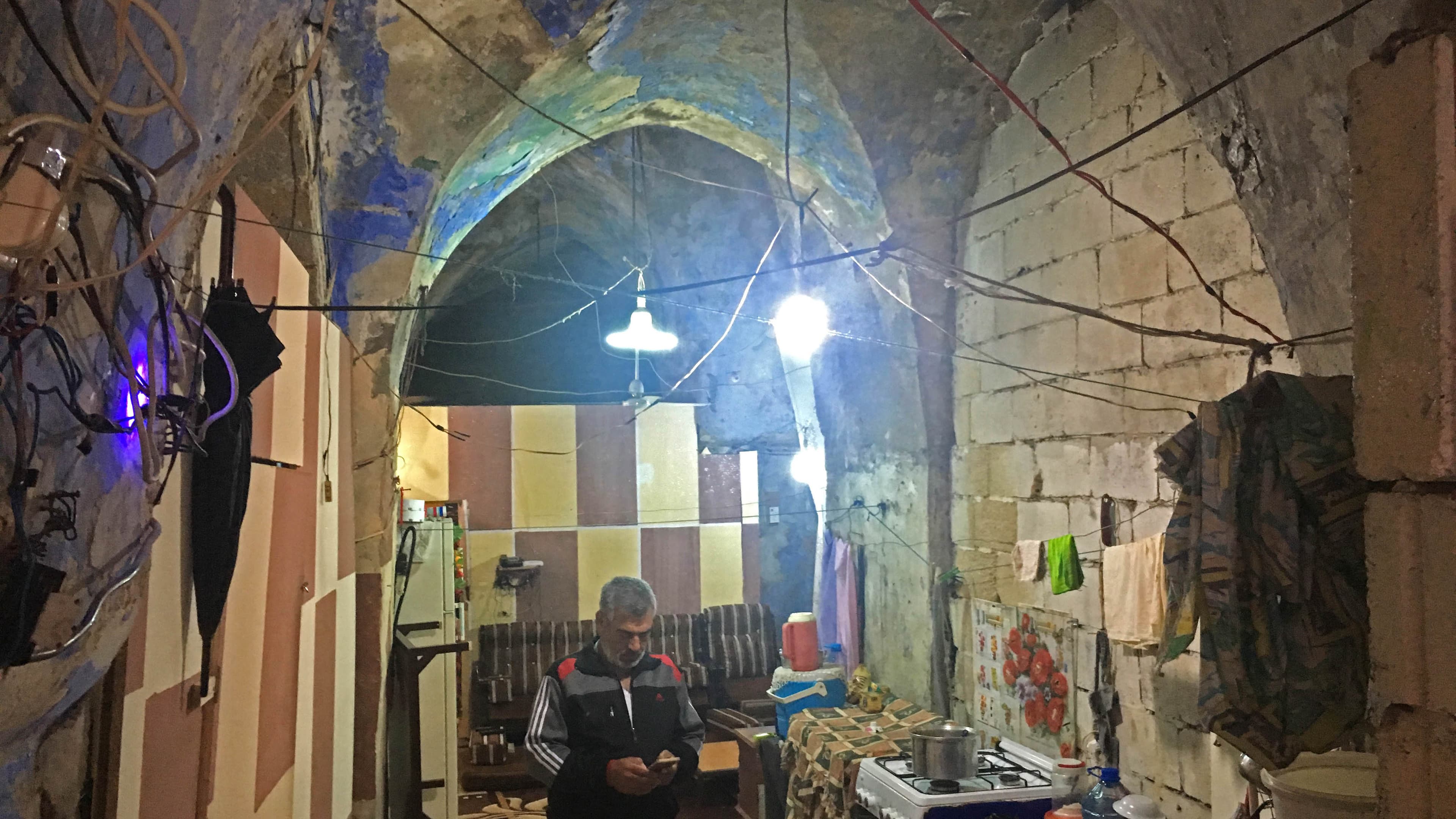 Jihad Al-Mohammed in his home in Saida. When he moved in, the centuries-old building was abandoned, but it used to be a Jewish synagogue.