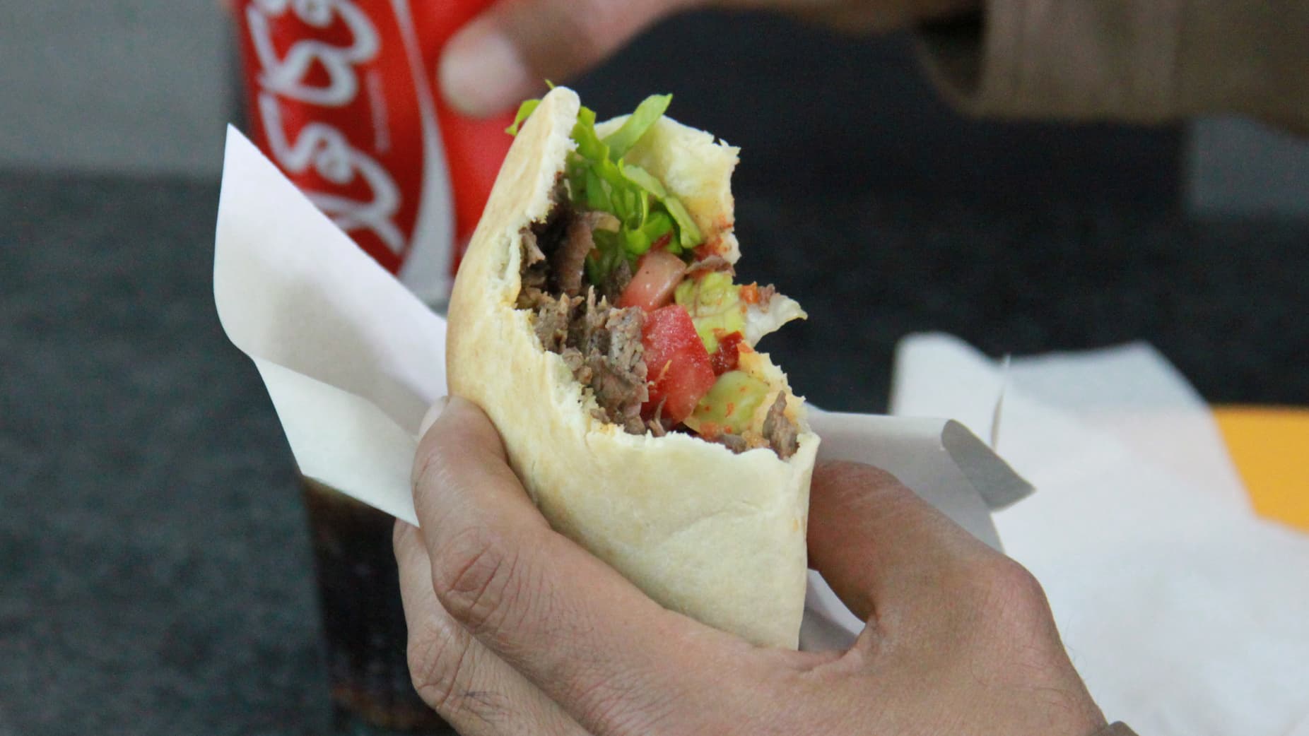 A shawarma sandwich in Jerusalem. Swap in pork for lamb, and a tortilla for a pita, and you've got the Mexican classic, Taco al Pastor.