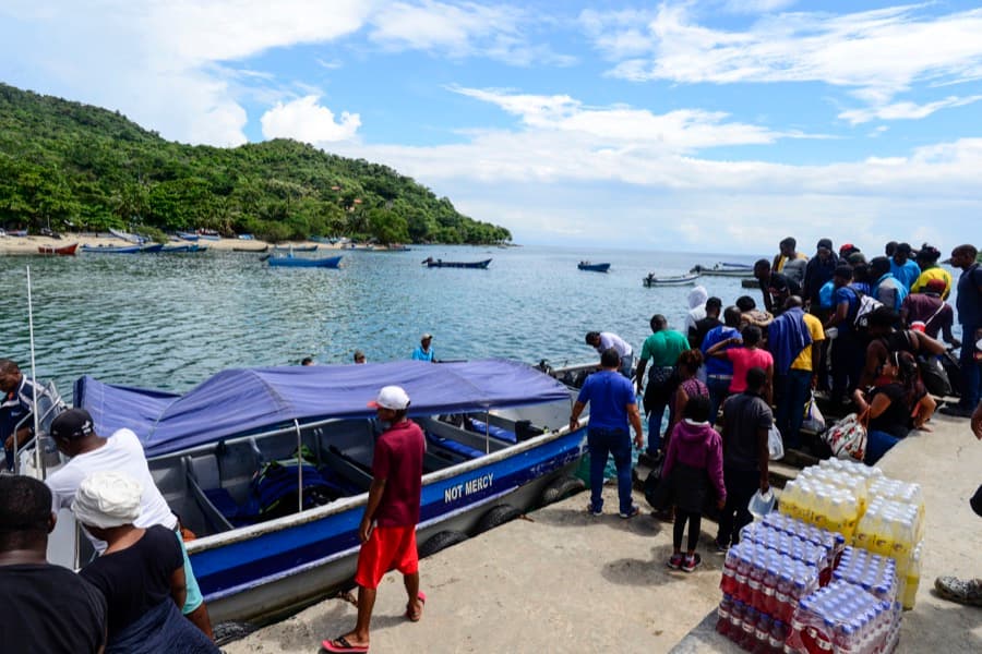 Migrants on dock at Capurgana, Colombia