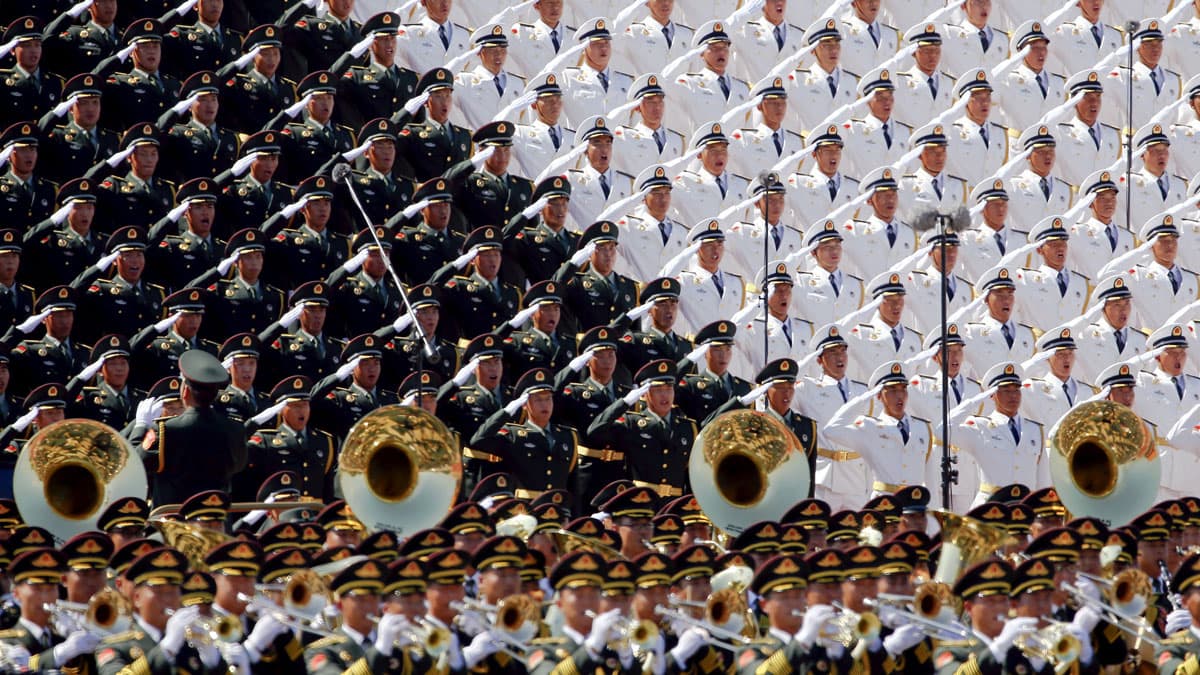 Military band sing and salute at the Tiananmen Square at the beginning of the military parade marking the 70th anniversary of the end of World War II, in Beijing, China, September 3, 2015.