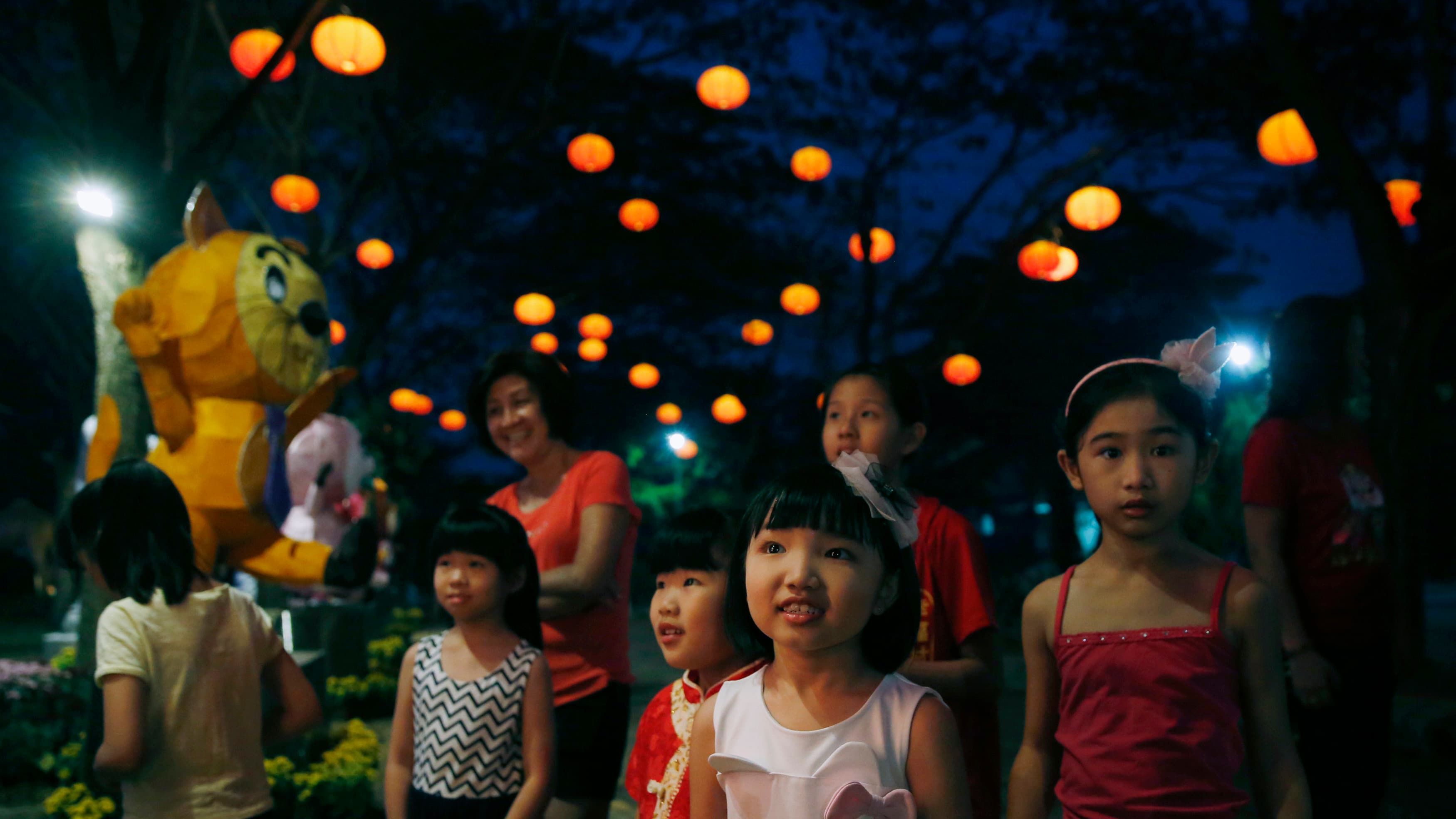 Children look at a light display for Chinese New Year outside Kuala Lumpur.
