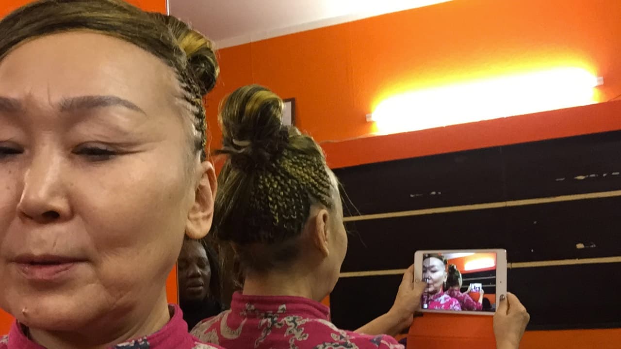 Sainkho Namtchylak takes a selfie of her cornrows.