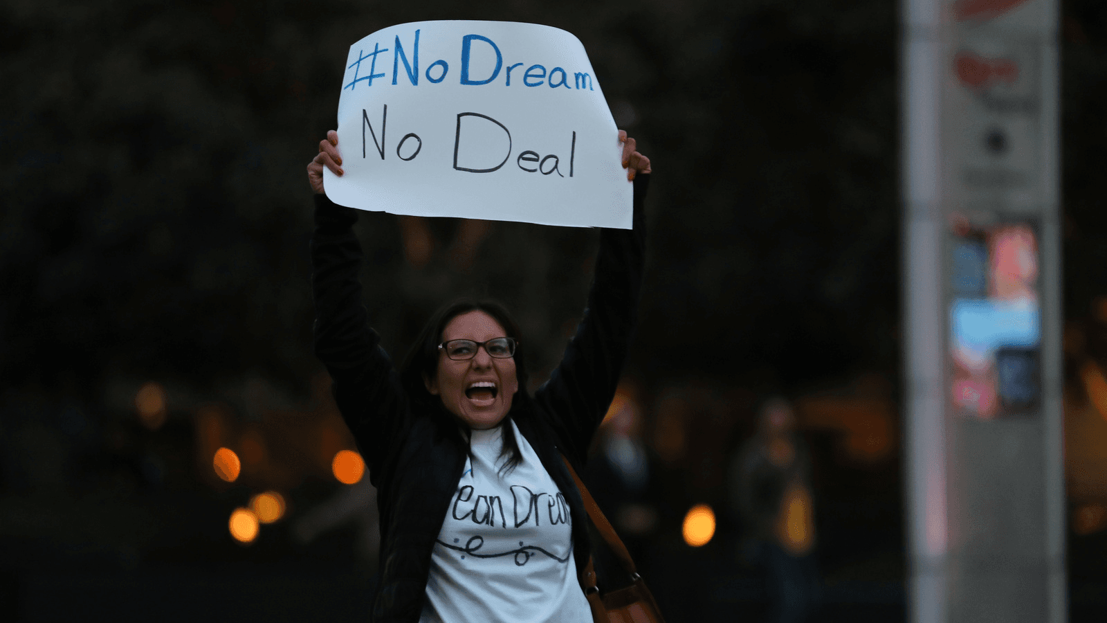 A small group of demonstrators block traffic to demand action by the federal government on the Deferred Action for Childhood Arrivals (DACA) in downtown San Diego, California, Dec. 4, 2017.