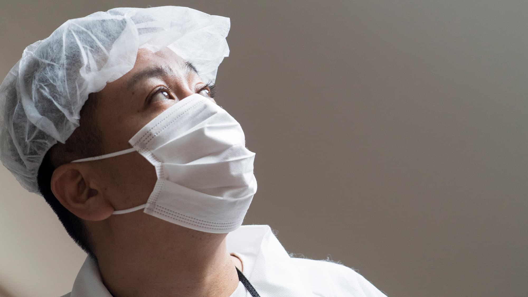 When Yuji Onuma was a kid, he lived in Futaba, a part of Fukushima. Today, he has kids of his own — but they can’t go near Futaba. Here, he wears protective clothing during a visit to his old house.
