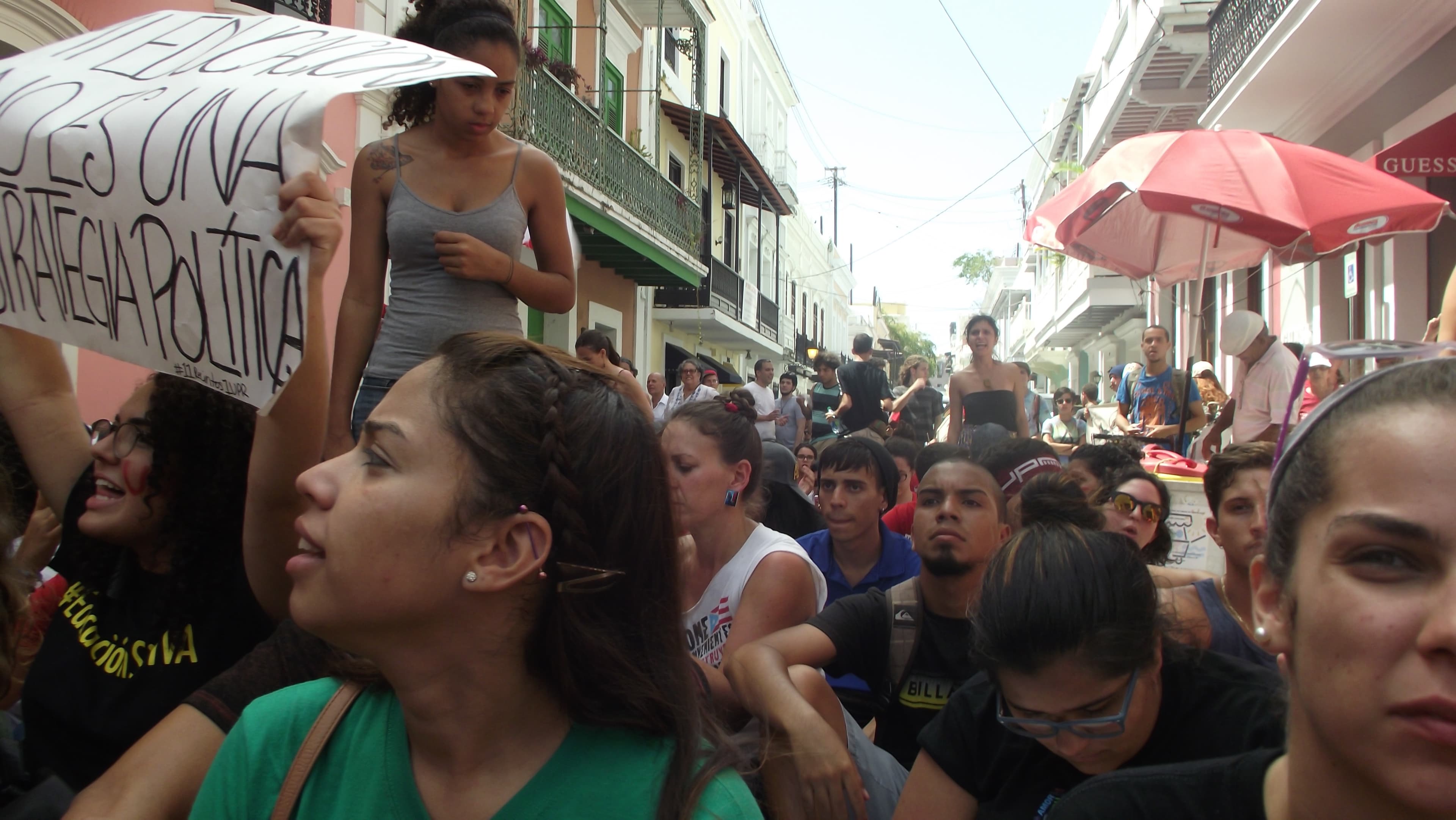 After almost four hours of protest on May 13, students sit down while they await to hear the results of the conversation between student representatives and government officials.