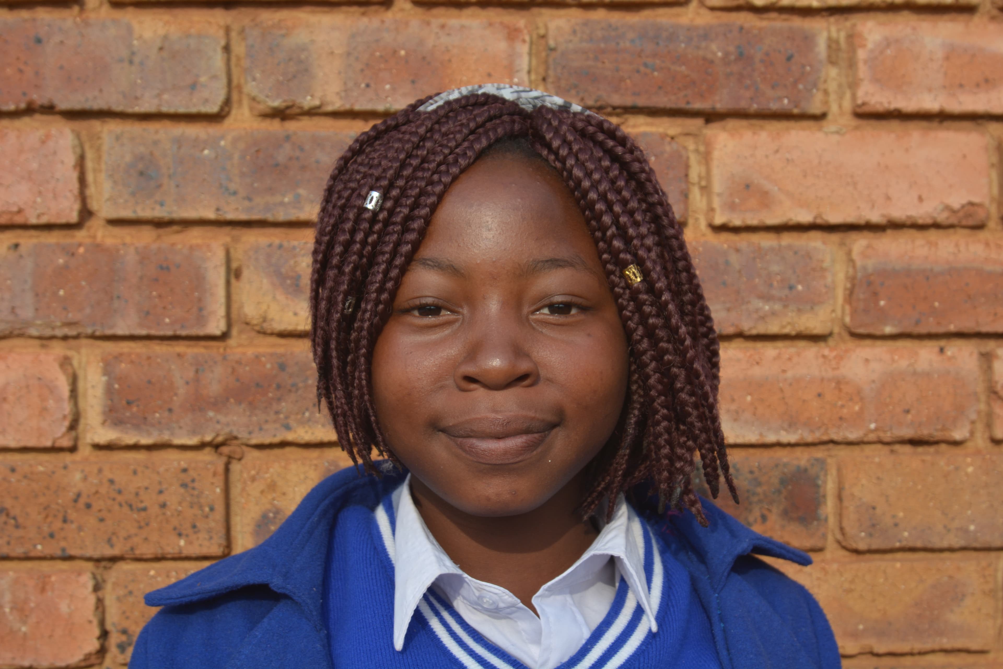 Close-up of the face of Nhlanhla, an HIV positive teen mom in South Africa.