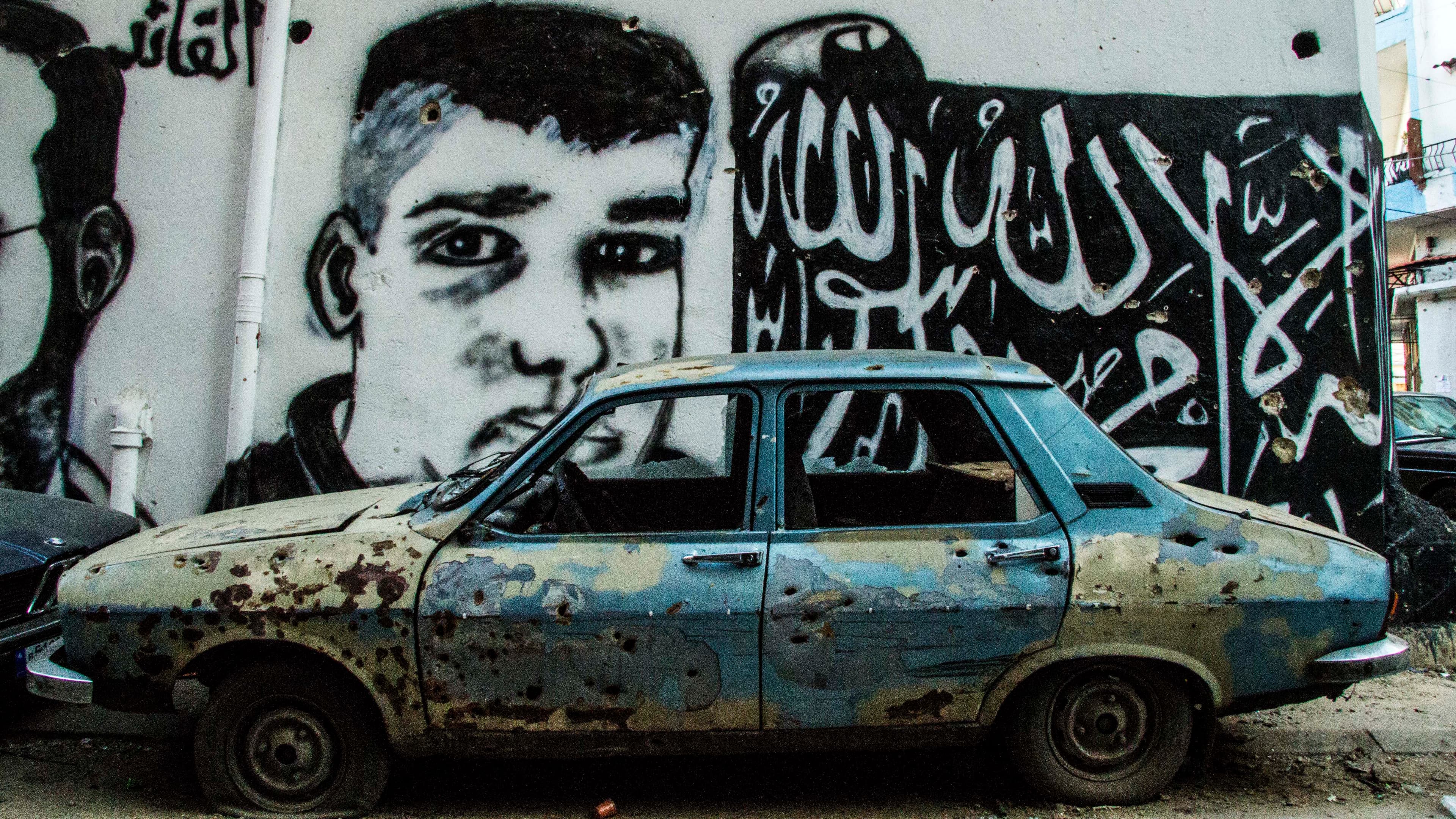 Fresh martyr portraits painted on a side street in Tripoli's Bab al-Tabbaneh neighborhood. Clashes last month in the economically deprived neighborhood left at least 11 soldiers, 8 civilians and 22 militants dead.