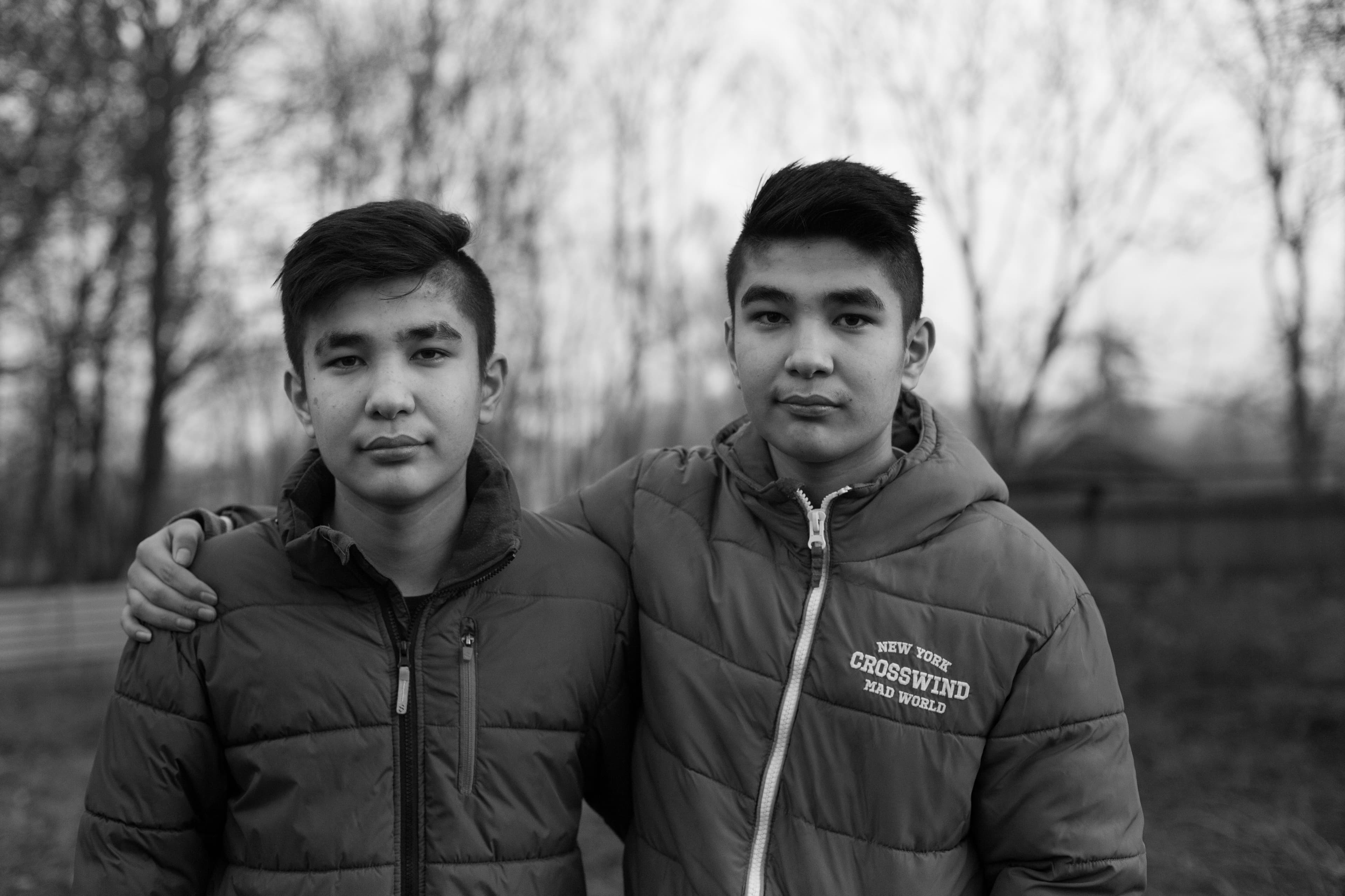 Afghani twins stand next to each other