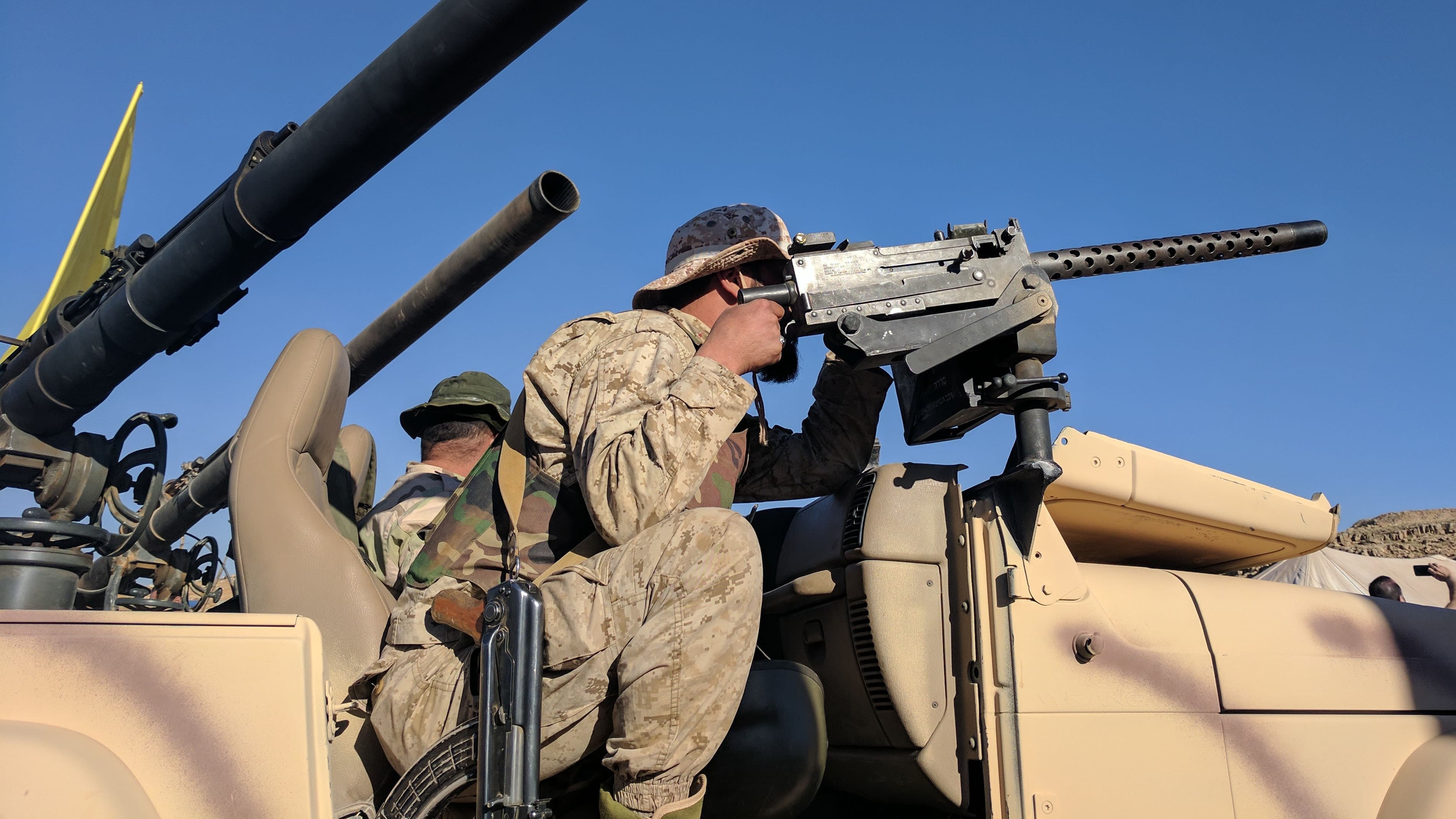 A Hezbollah fighter poses for journalists on a tour of areas recently recaptured from Nusra militants in the mountains between Lebanon and Syria.