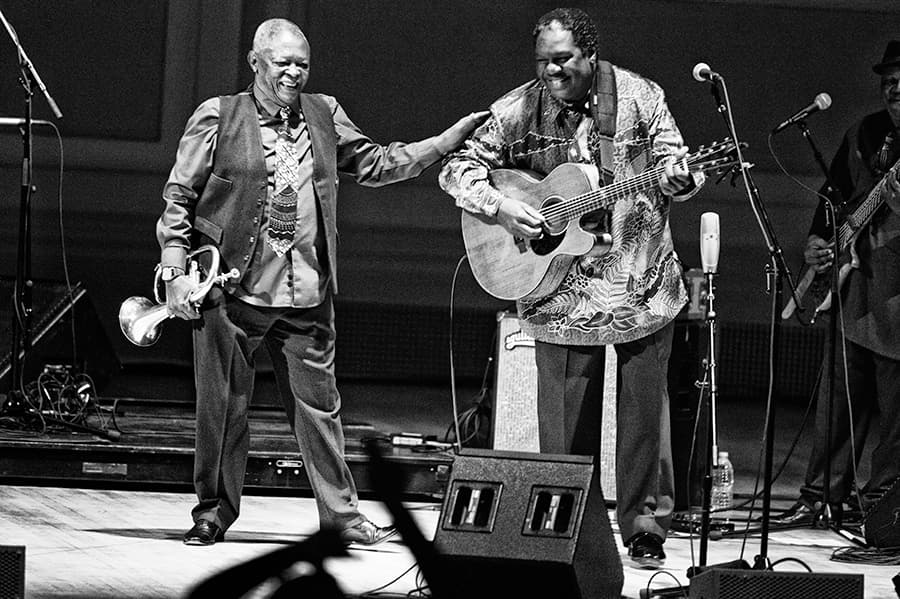 Hugh Masekela and Vusi Mahlasela on stage October 14, 2014, at Carnegie Hall in New York.