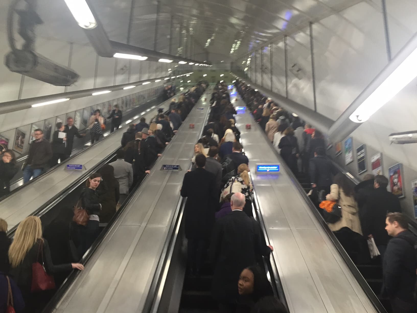 Morning commuters fill four escalators at Holborn Station in London, UK.