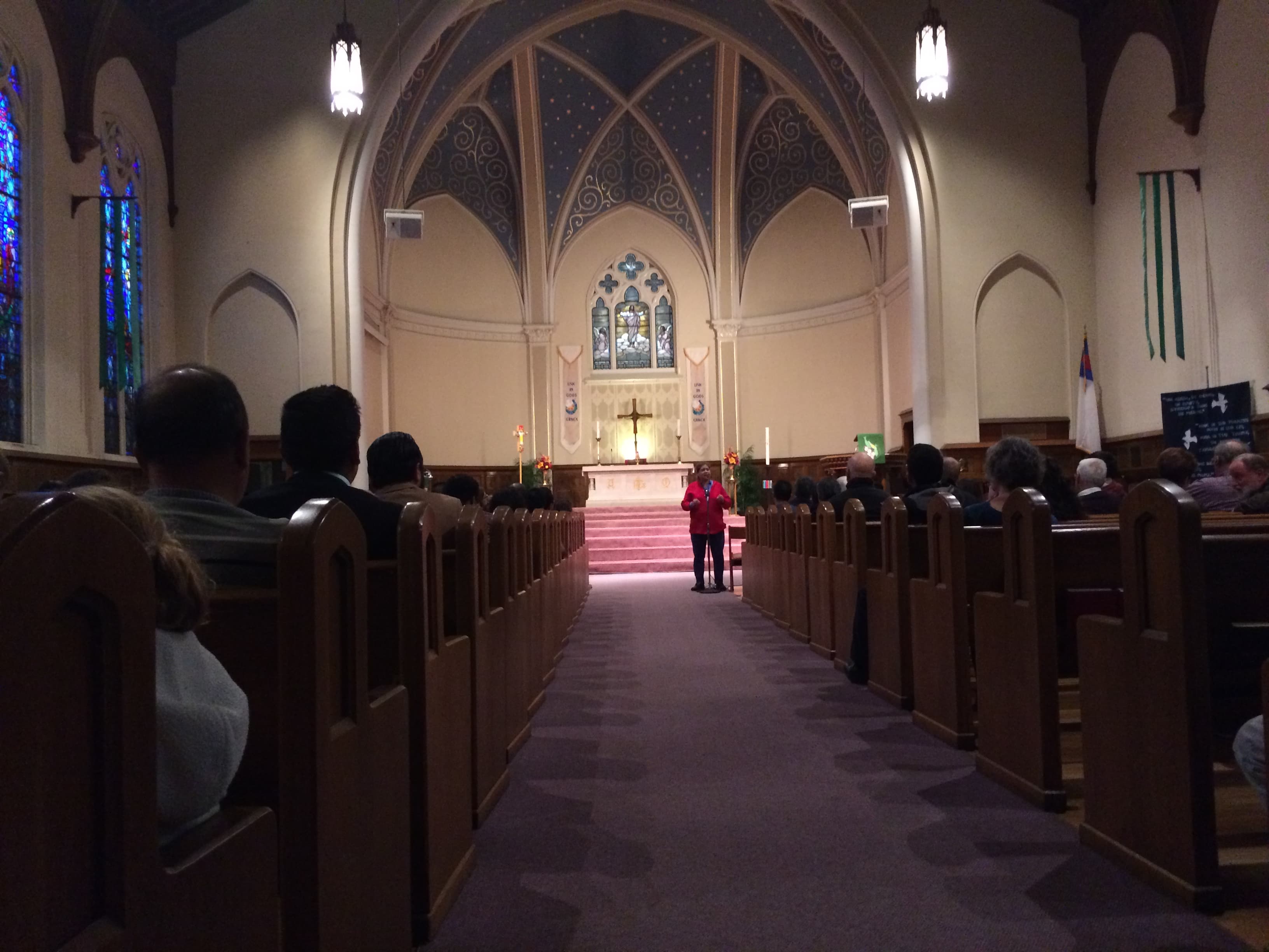 A women a the front of a church speaking