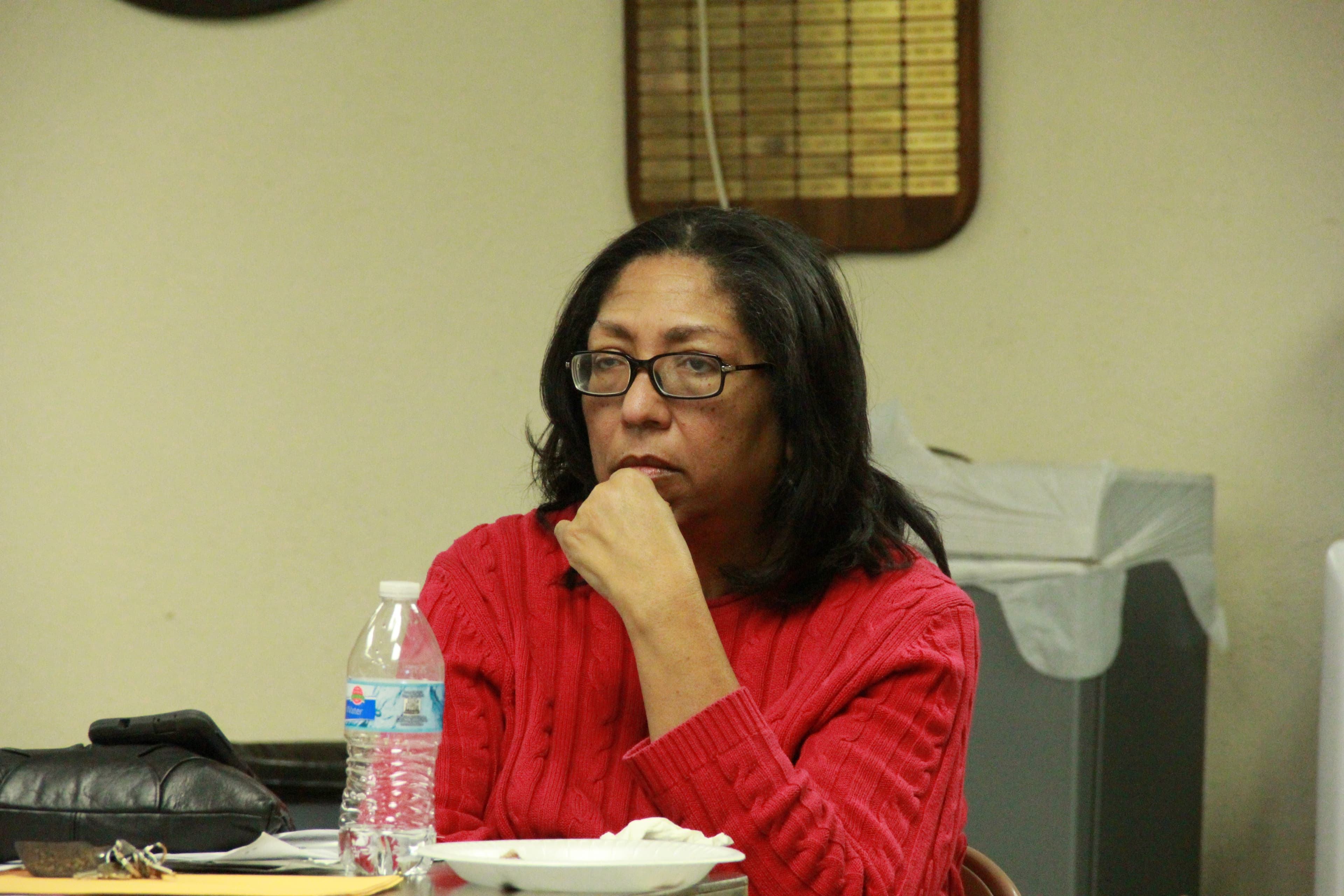 A woman sits at a table