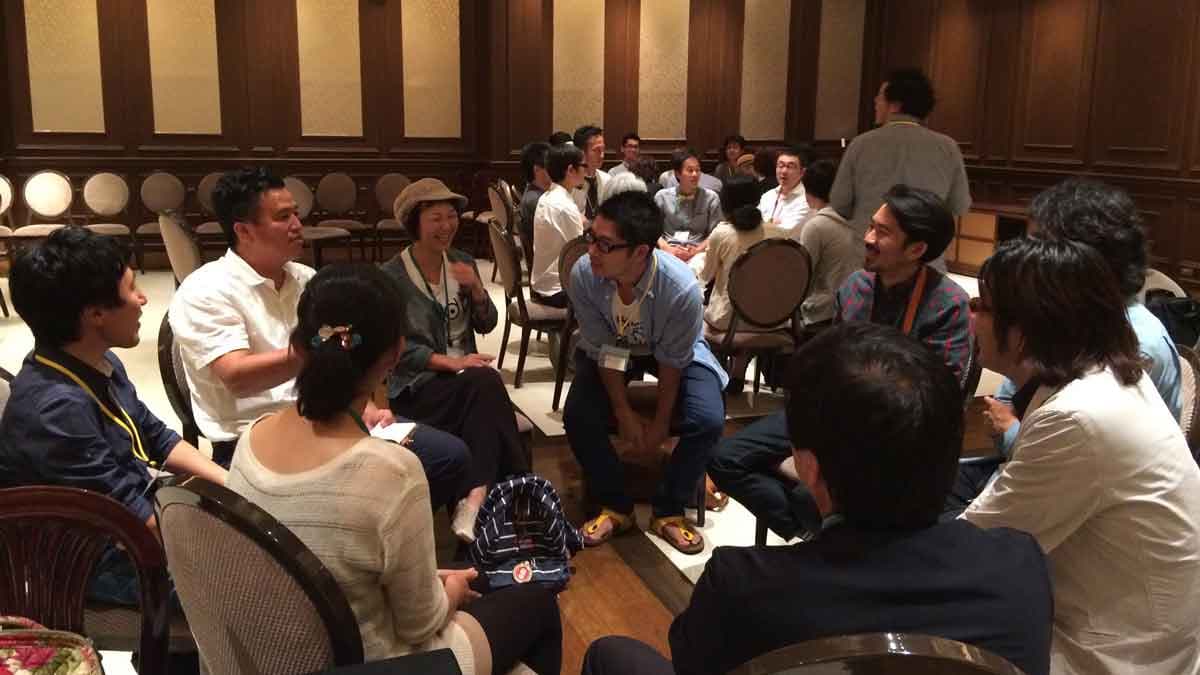 Participants at the Kamacon town meeting break into groups and brainstorm about the potential projects.
