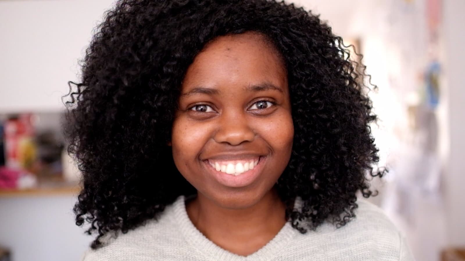 Close-up of Saidy Brown wearing a gray shirt