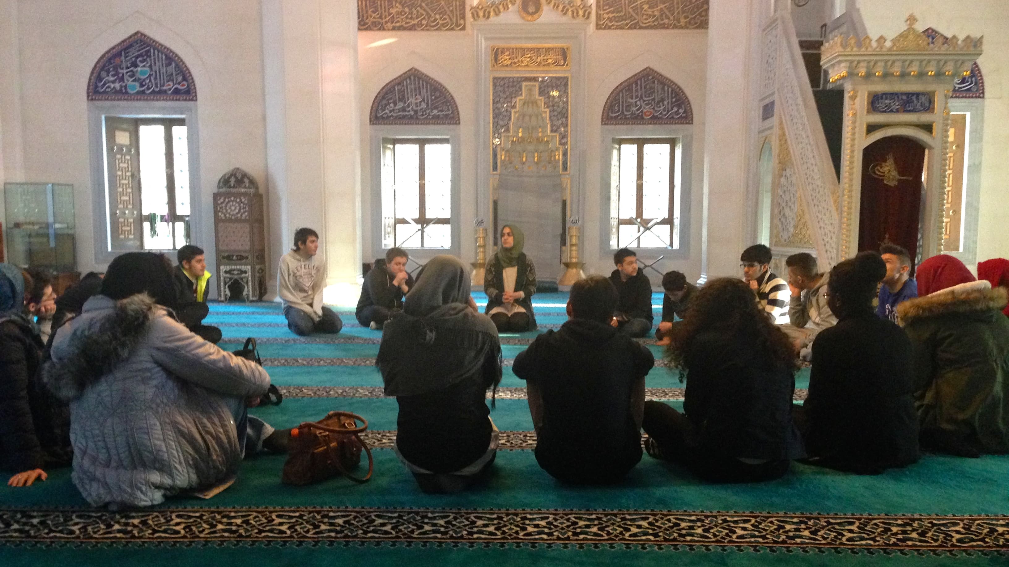 Betul Ulusoy (center back) leads an educational tour of Sehitlik Mosque in Berlin.