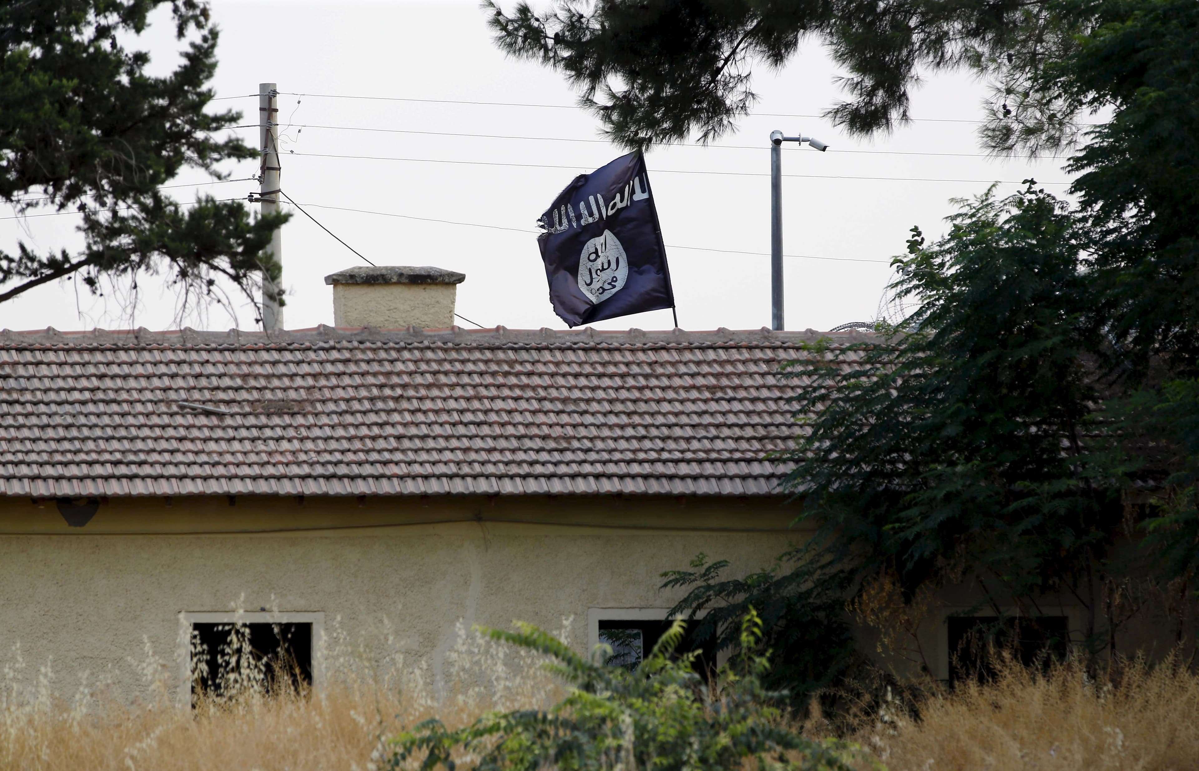 Black and white flag on roof of building