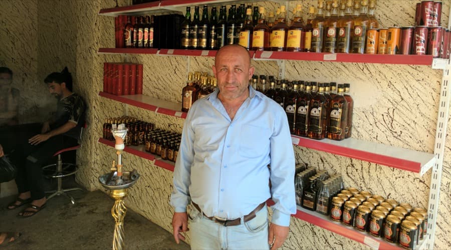 Ibrahim Noel reopened his liquor store in Qaraqosh, northern Iraq, after he said ISIS demolished it.