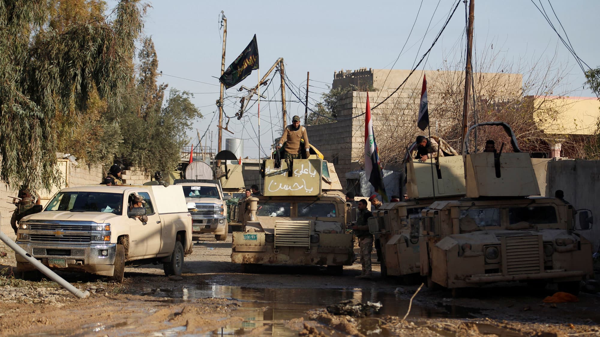 Iraqi soldiers gather during a battle with ISIS militants, north of Mosul, Iraq, December 30, 2016.