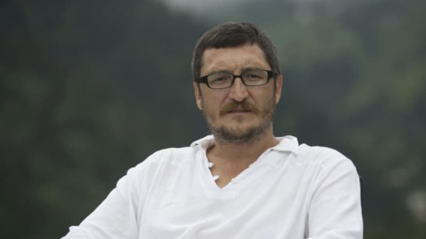 Koray Caliskan seated.