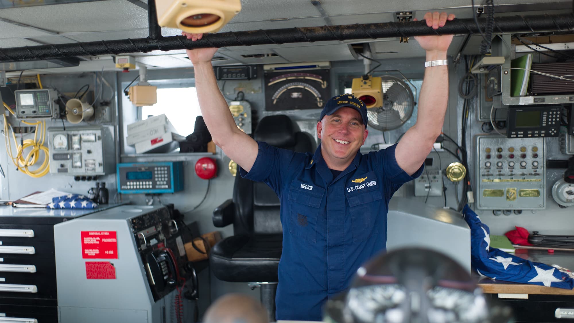 Lieutenant Commander Christian Medick on the bridge of US Coast Guard Cutter