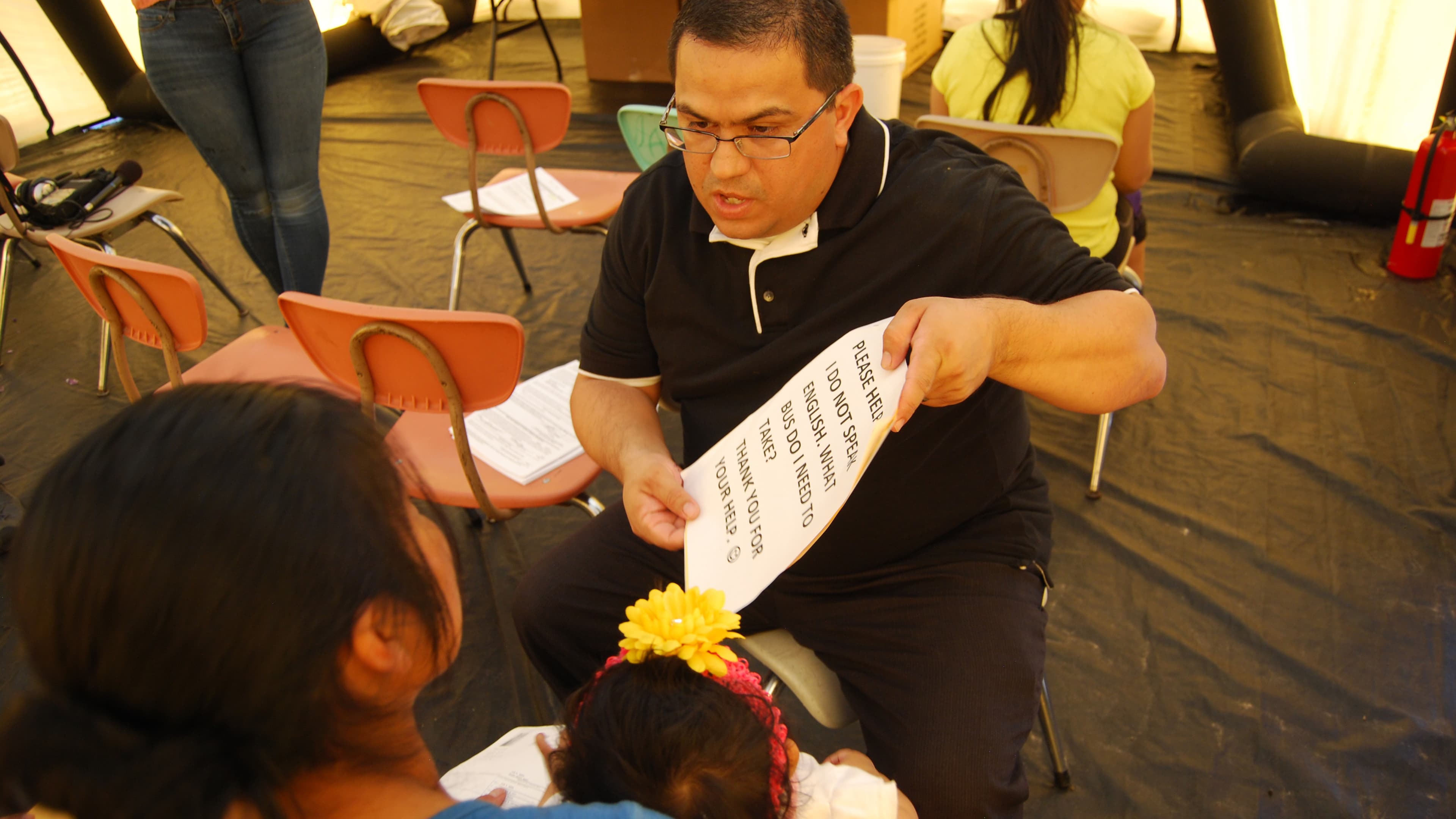Carlos Garcia, an immigration attorney in McAllen, Texas, volunteers his time once a week to help newly arrived migrants understand the legal immigration system they're about to enter.