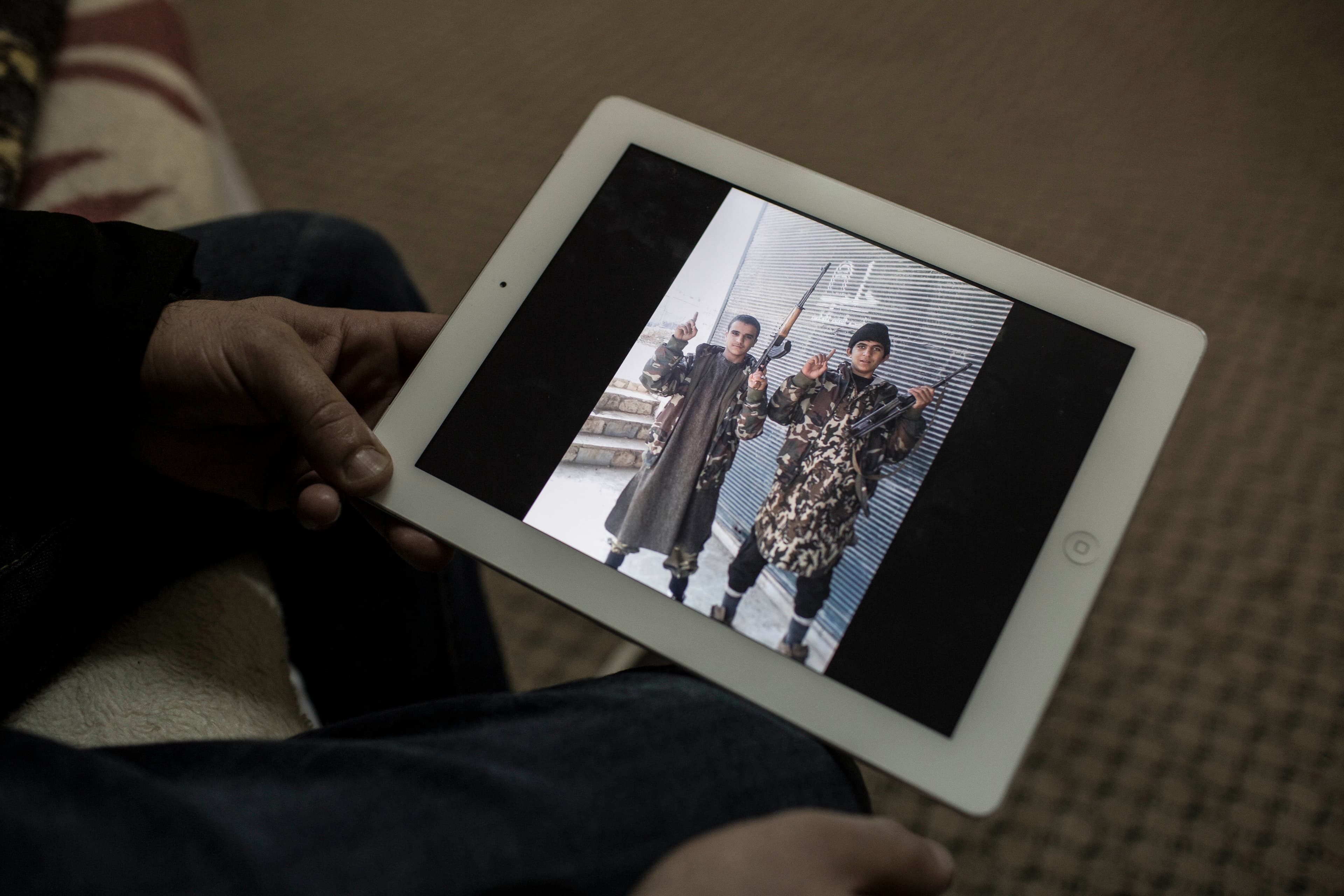 In this Facebook posting, Ayoub and his high school friend each hold up one finger, a sign many jihadists use to show they're willing to die for god.