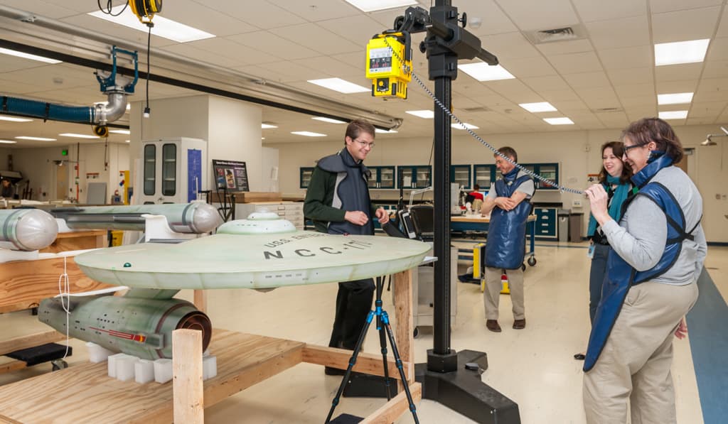 Conservator Ariel O’Connor uses X-ray fluorescence spectrometry to determine what metal alloy was used to construct the port engine of the Enterprise model