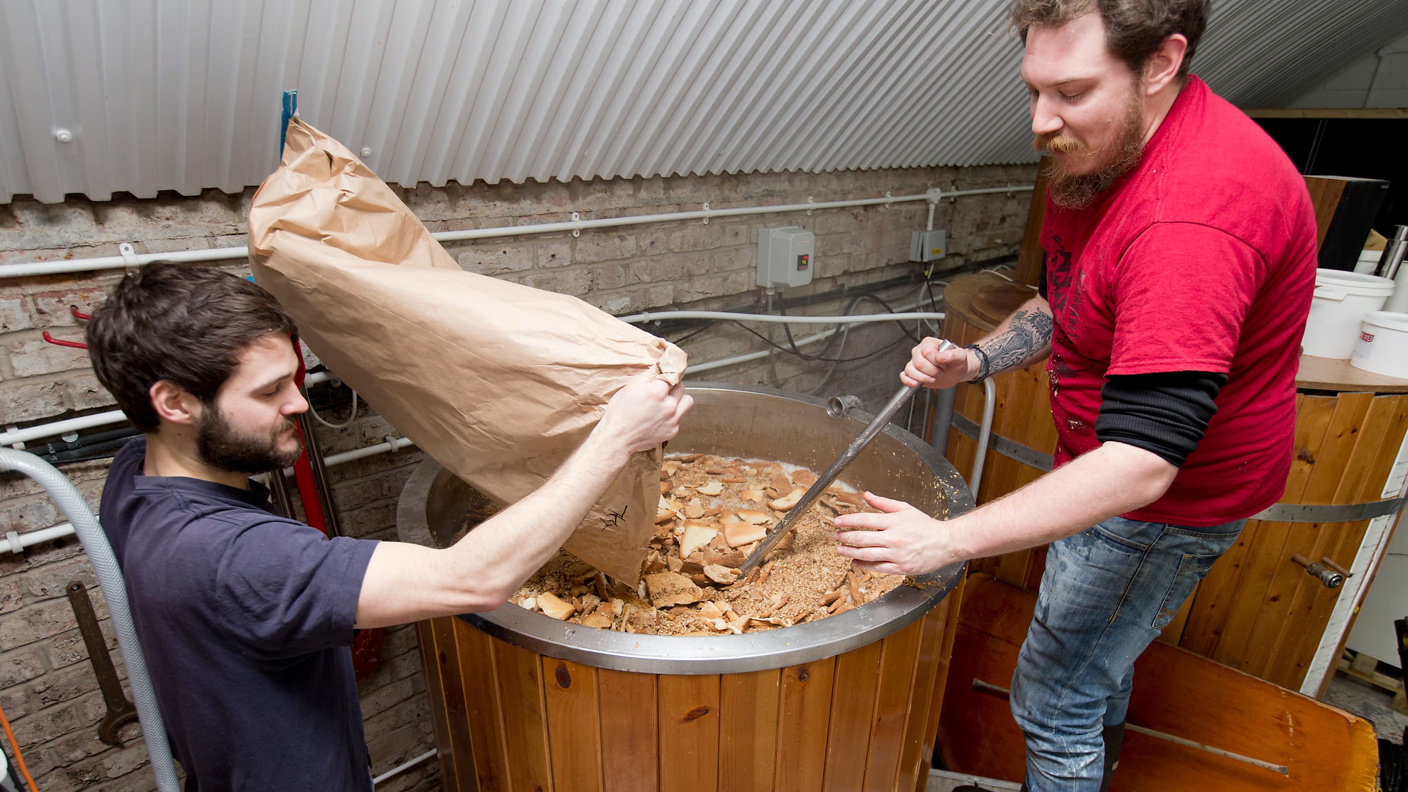 Two men brewing with bread