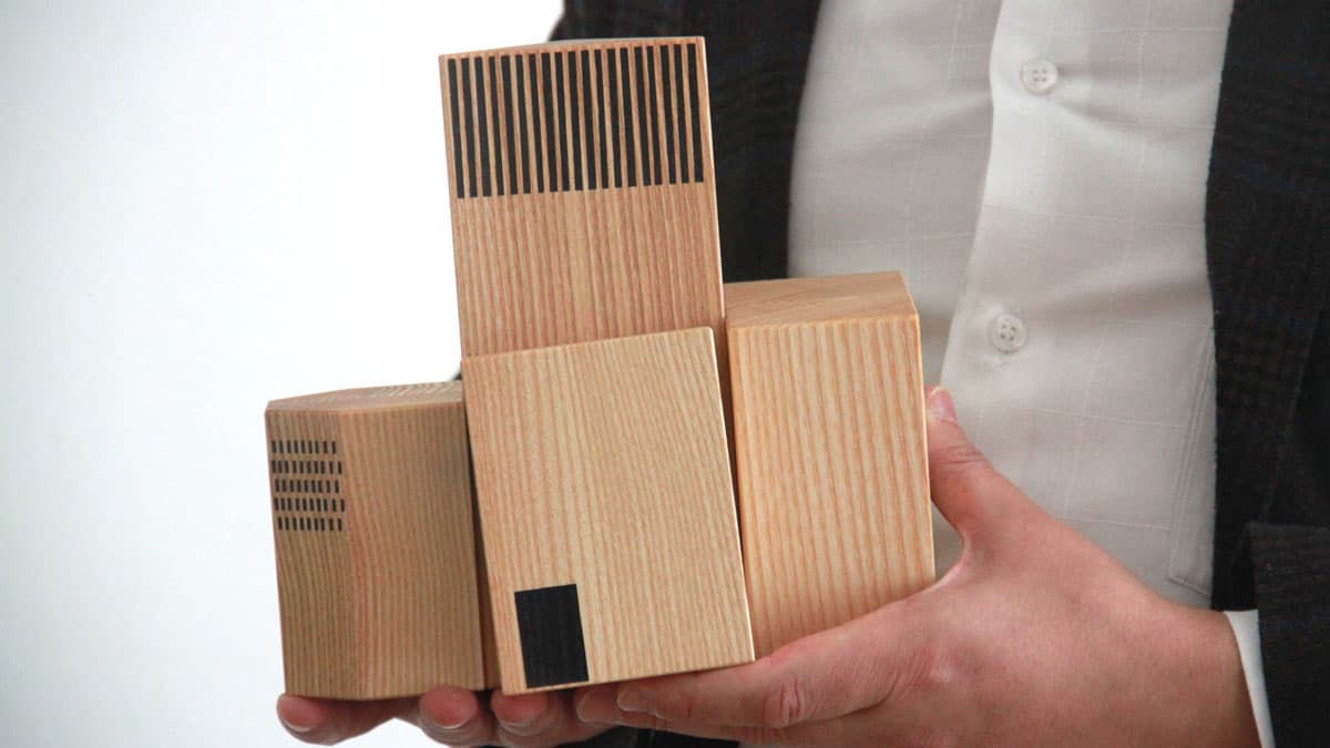 Imam Kadir Sanci holds a model of the House of One in Berlin.