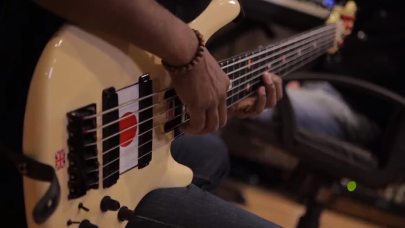 Nathan East playing his bass guitar.