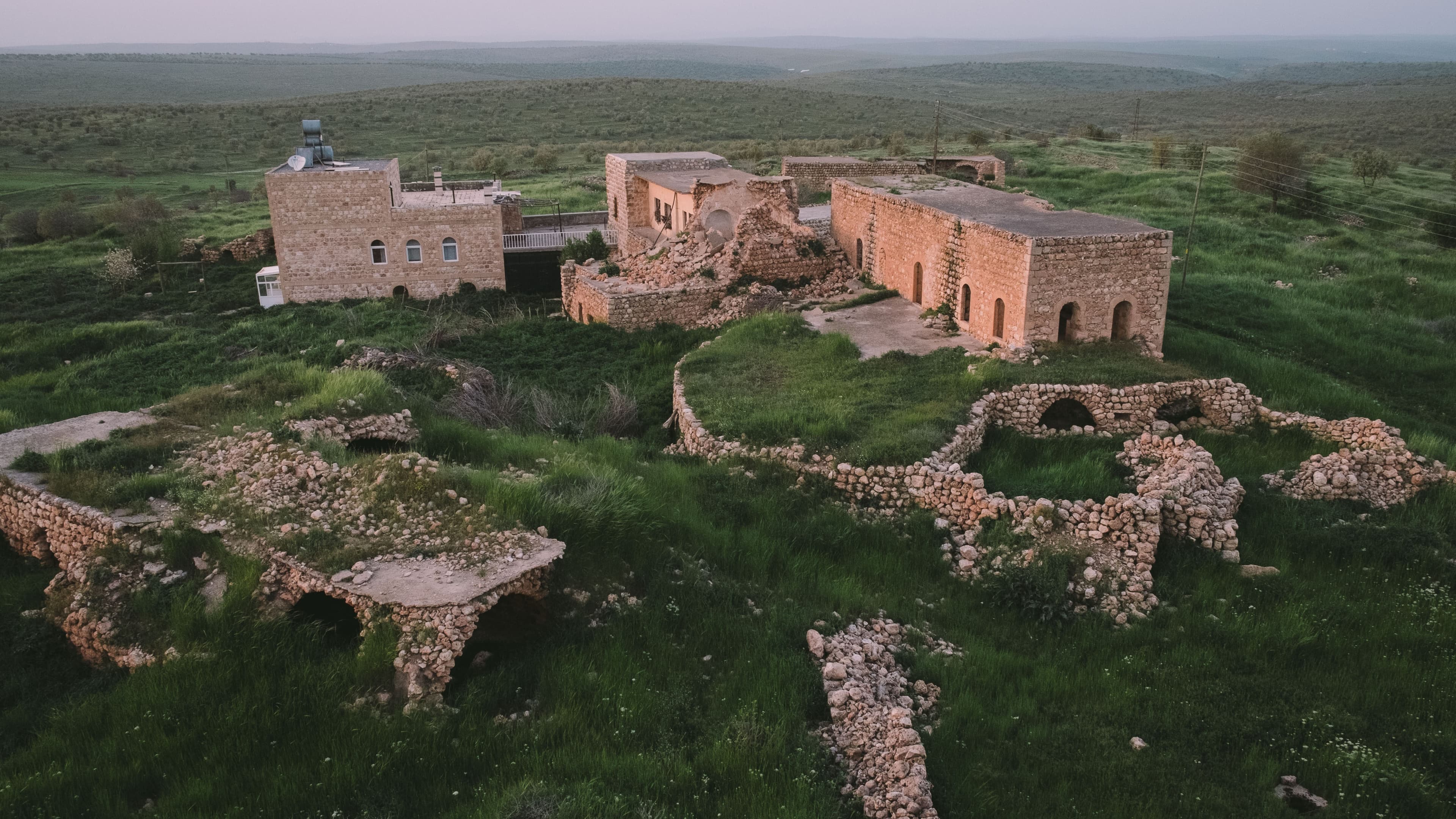 Old and new houses sit side by side in the southern Turkish village of Kafro.