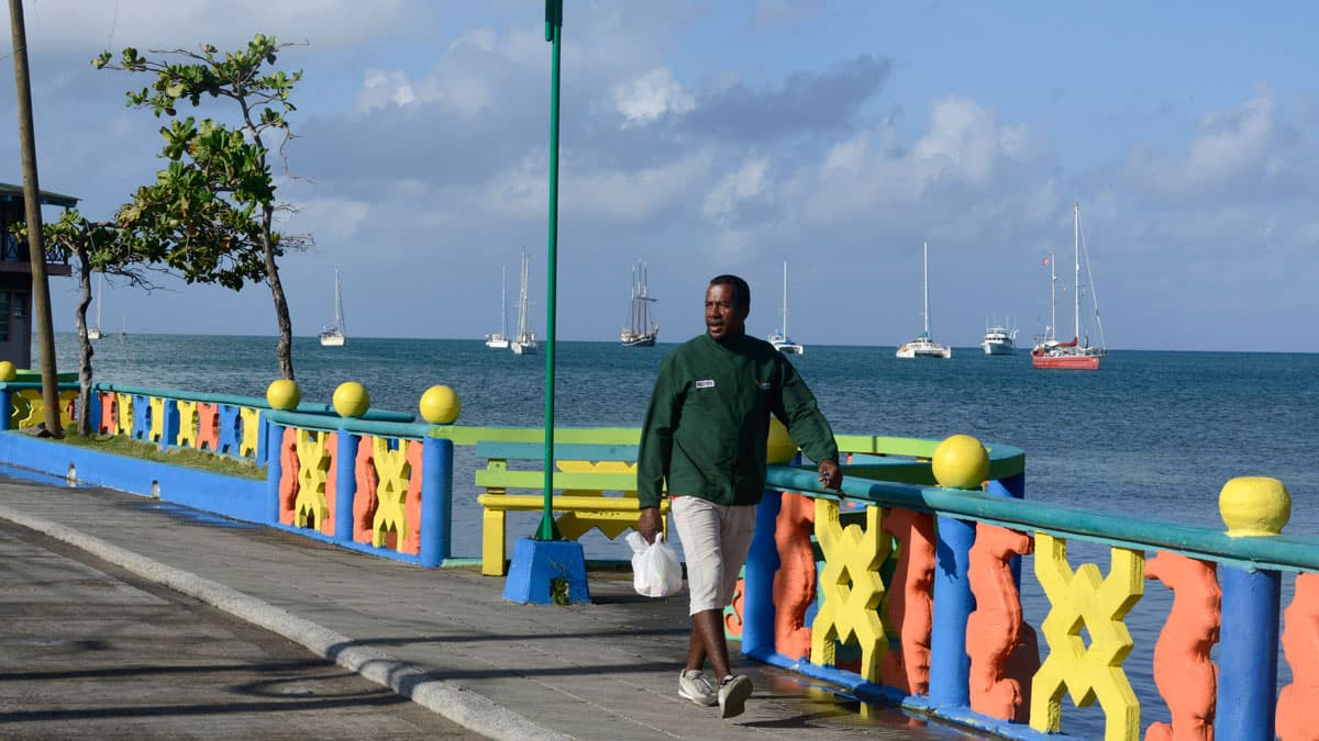 A man walks along the coast of Old Providence.