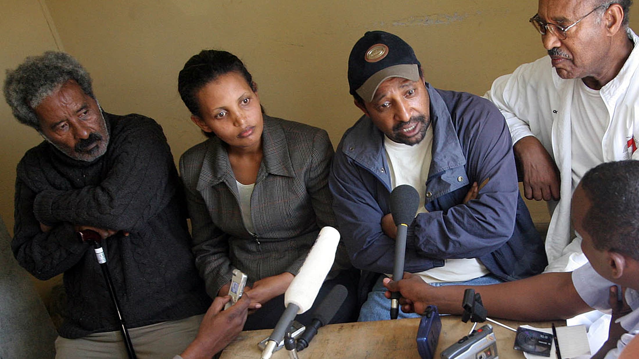 Berhanu Nega (in baseball cap), with other opposition leaders, speaking to reporters in Addis Ababa in 2005 after elections won by his party were annulled by the regime.
