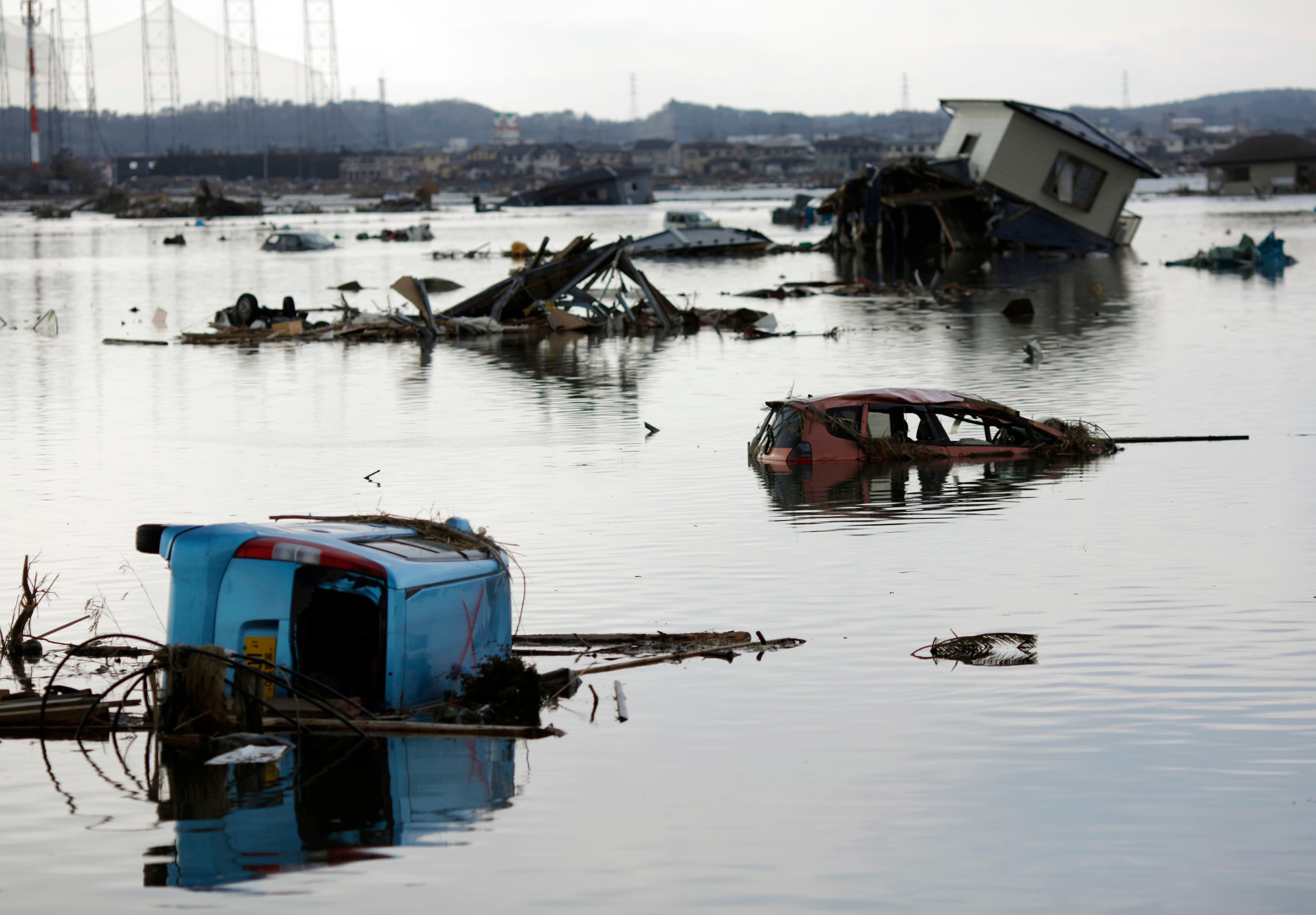 A house and vehicles damaged by the March 2011 earthquake and tsunami, as seen in Ishinomaki, northern Japan.