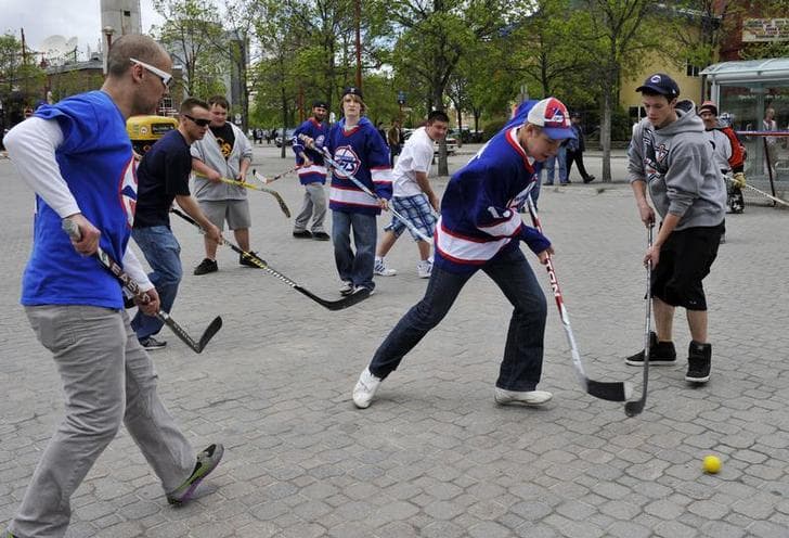 Scenes like this of kids playing street hockey at the Forks Market in Winnipeg, Manitoba are becoming scarce in many Canadian cities.
