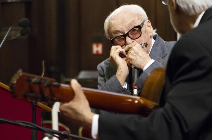 Belgian musician Toots Thielemans plays harmonica during a ceremony for his 90th birthday at Brussels' City Hall April 29, 2012. Thielemans was made honorary citizen of Brussels.